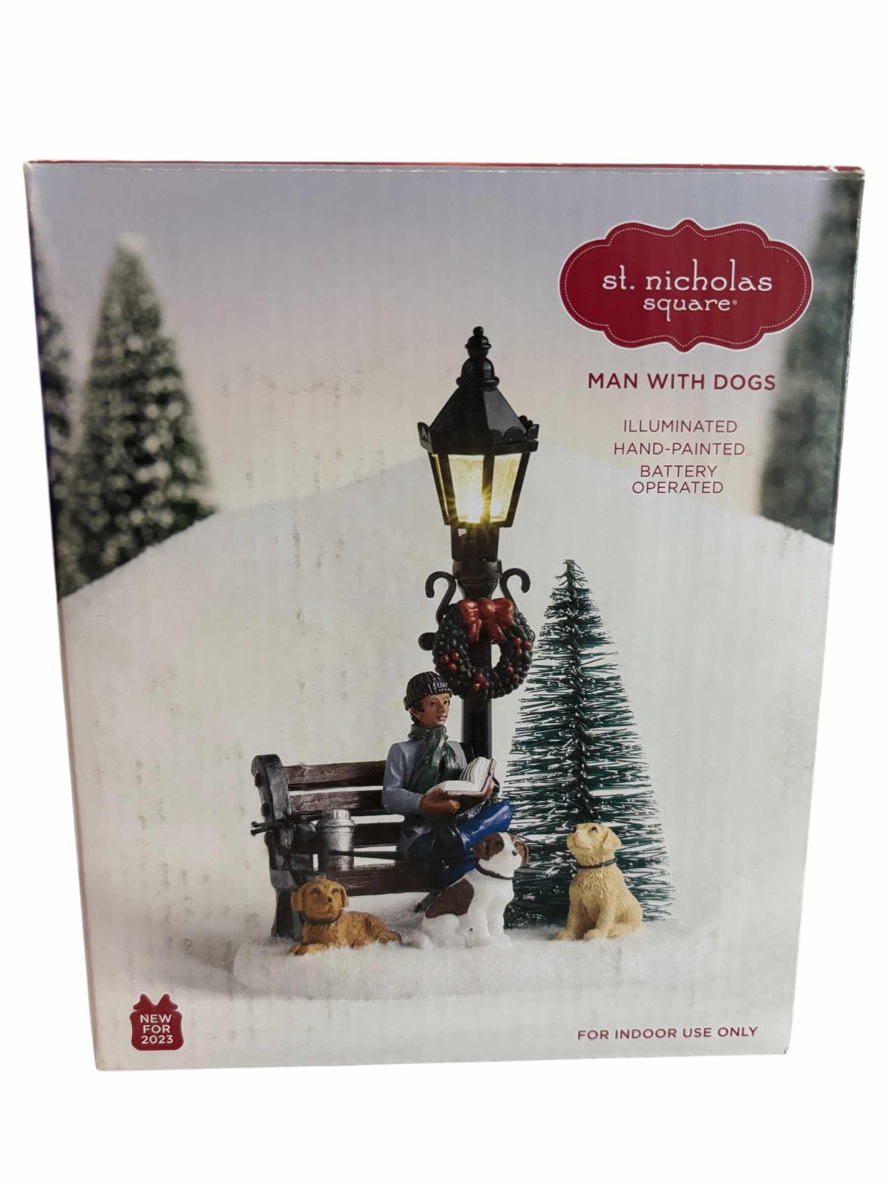 Photo 1 of ST. NICHOLAS SQUARE ILLUMINATED BATTERY OPERATED VILLAGE TABLE DECOR- MAN WITH DOGS