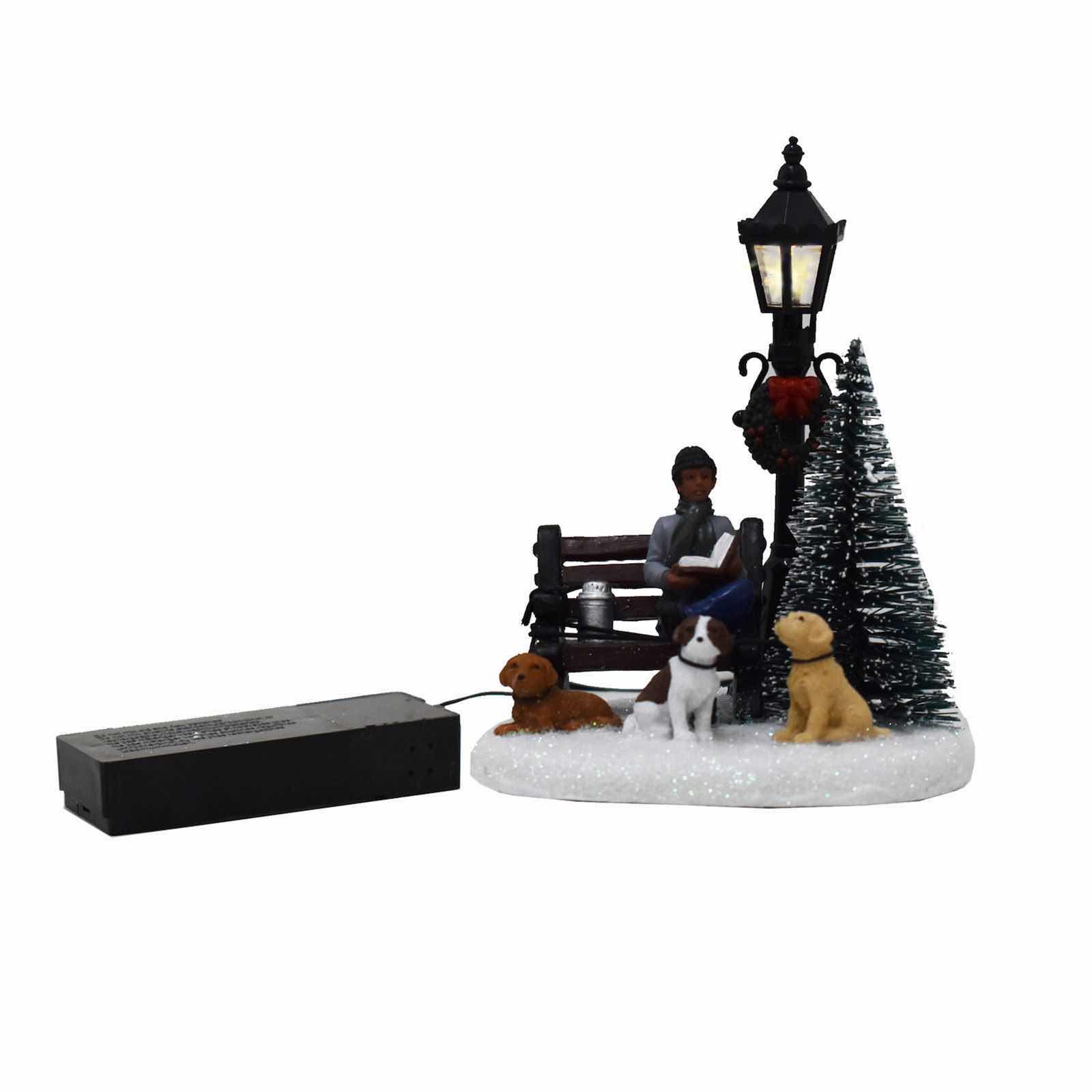 Photo 1 of ST. NICHOLAS SQUARE ILLUMINATED BATTERY OPERATED VILLAGE TABLE DECOR- MAN WITH DOGS