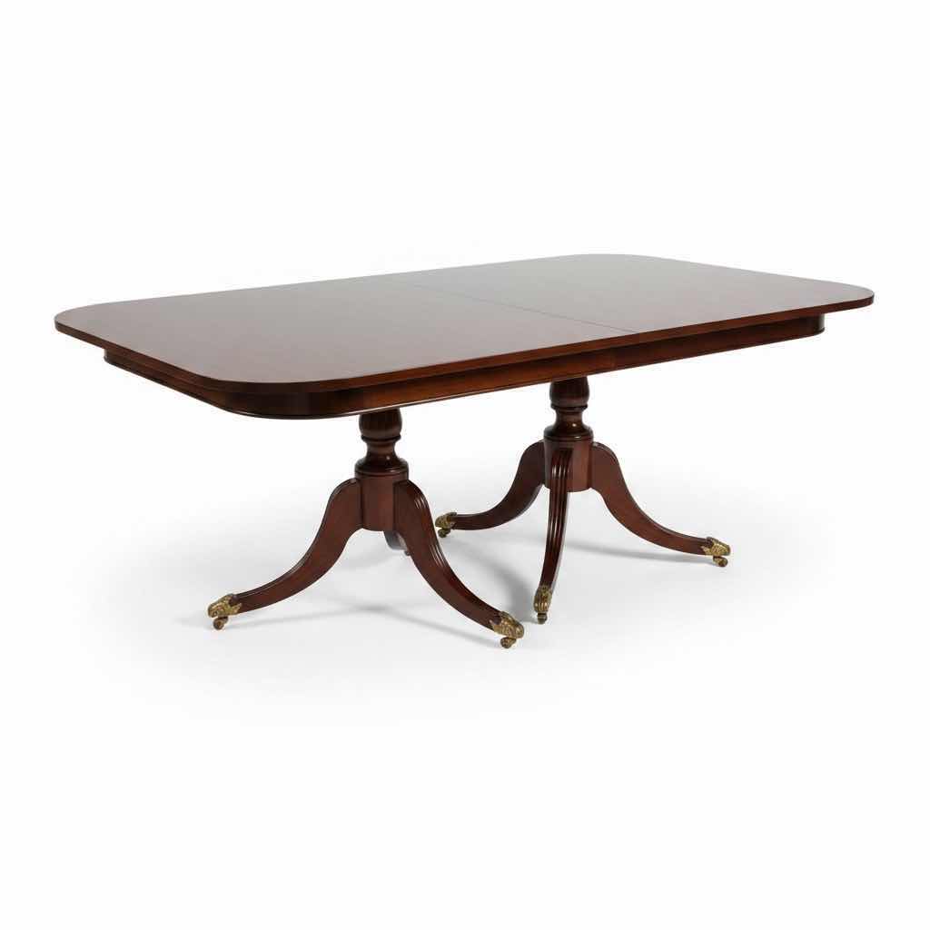 Photo 1 of ANTIQUE MAHOGANY ENGLISH DINING TABLE W/BRASS PAW FEET COMES WITH TWO ADDITIONAL LEAFS AND FOLDABLE TABLE COVERS 
72”X48”H30 W LEAFS TOTAL L144”