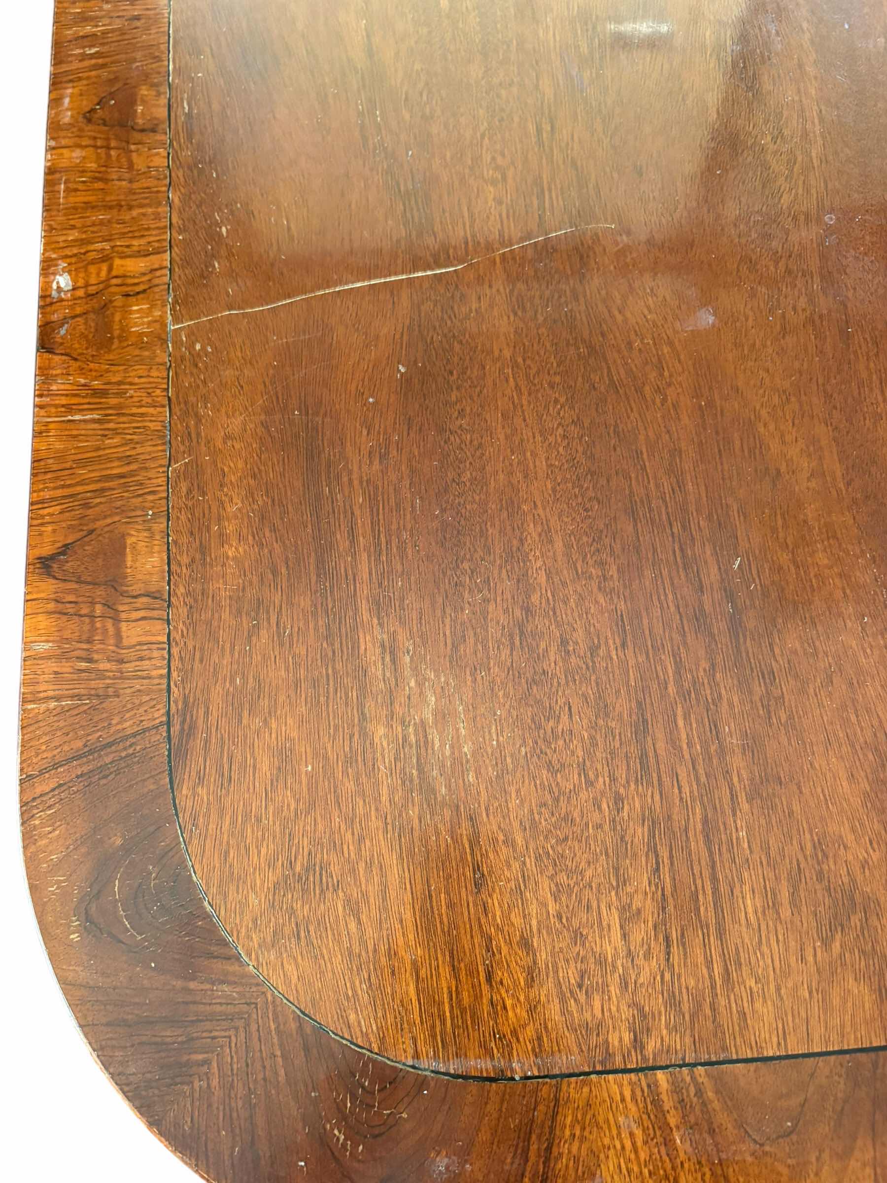Photo 1 of ANTIQUE MAHOGANY ENGLISH DINING TABLE W/BRASS PAW FEET COMES WITH TWO ADDITIONAL LEAFS AND FOLDABLE TABLE COVERS 
72”X48”H30 W LEAFS TOTAL L144”