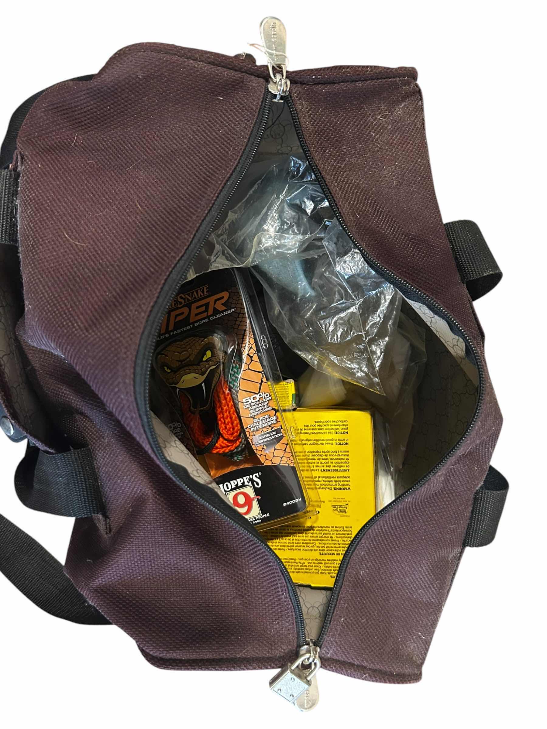Photo 1 of DUFFLE BAG WITH AMMO AND GUN CLEANING SUPPLIES
