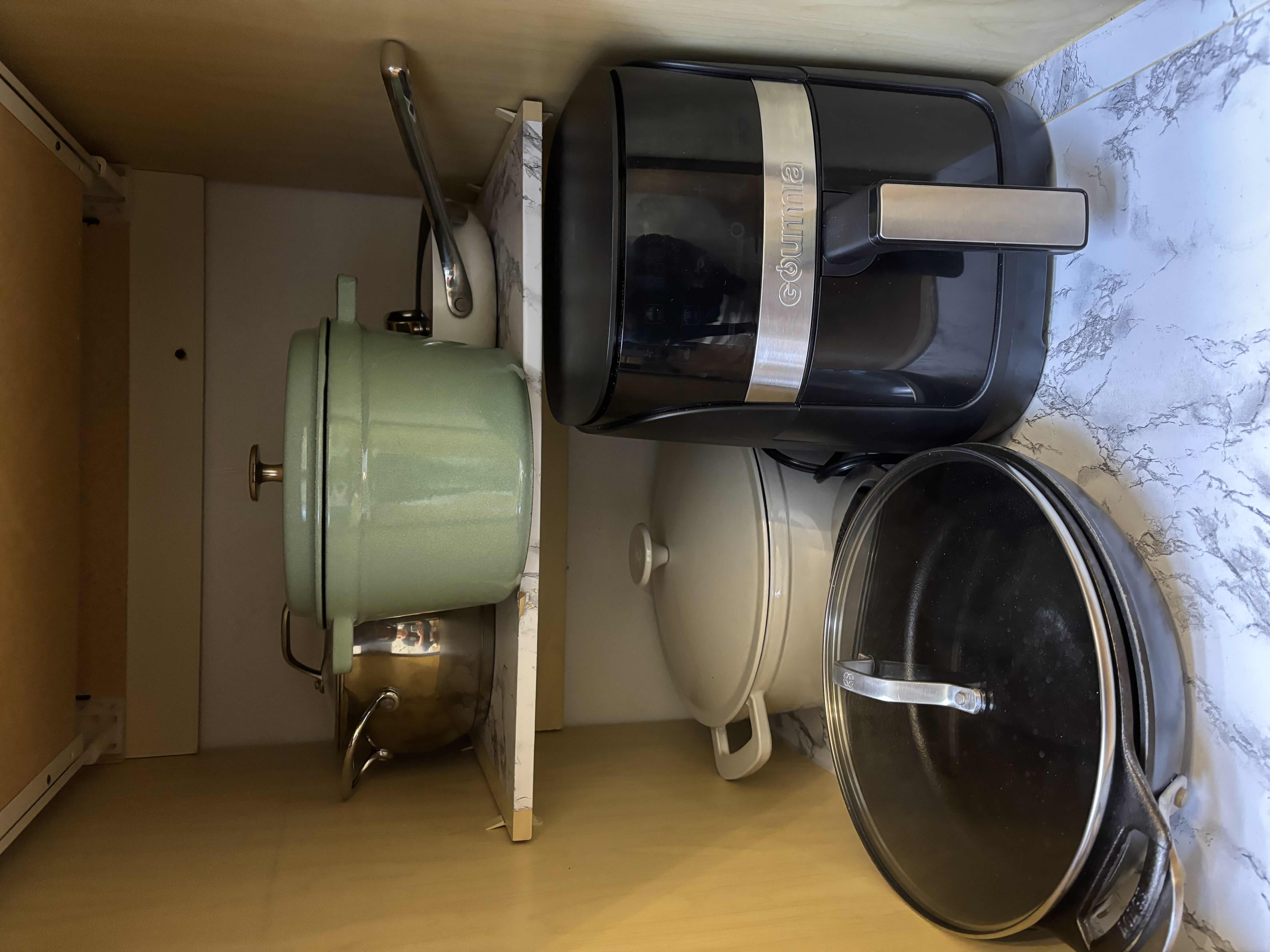 Photo 1 of CONTENTS OF KITCHEN CABINET: DUTCH OVENS (2), CAST IRON SKILLET, AIR FRYER & MORE