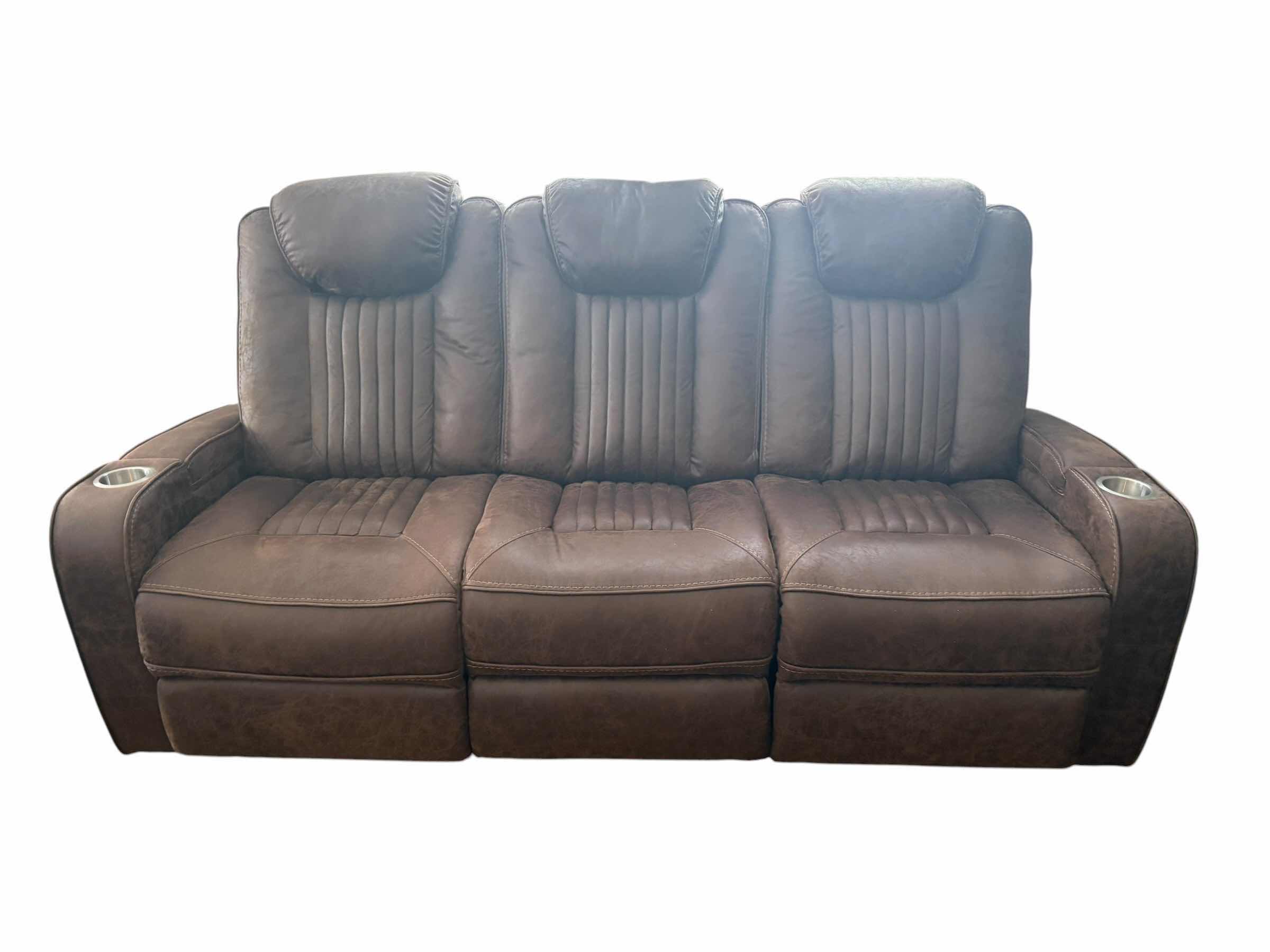 Photo 1 of BROWN LEATHER POWER SOFA RECLINER W ADJUSTABLE HEAD REST AND CUP HOLDERS 83”X34”H42.5” $3199