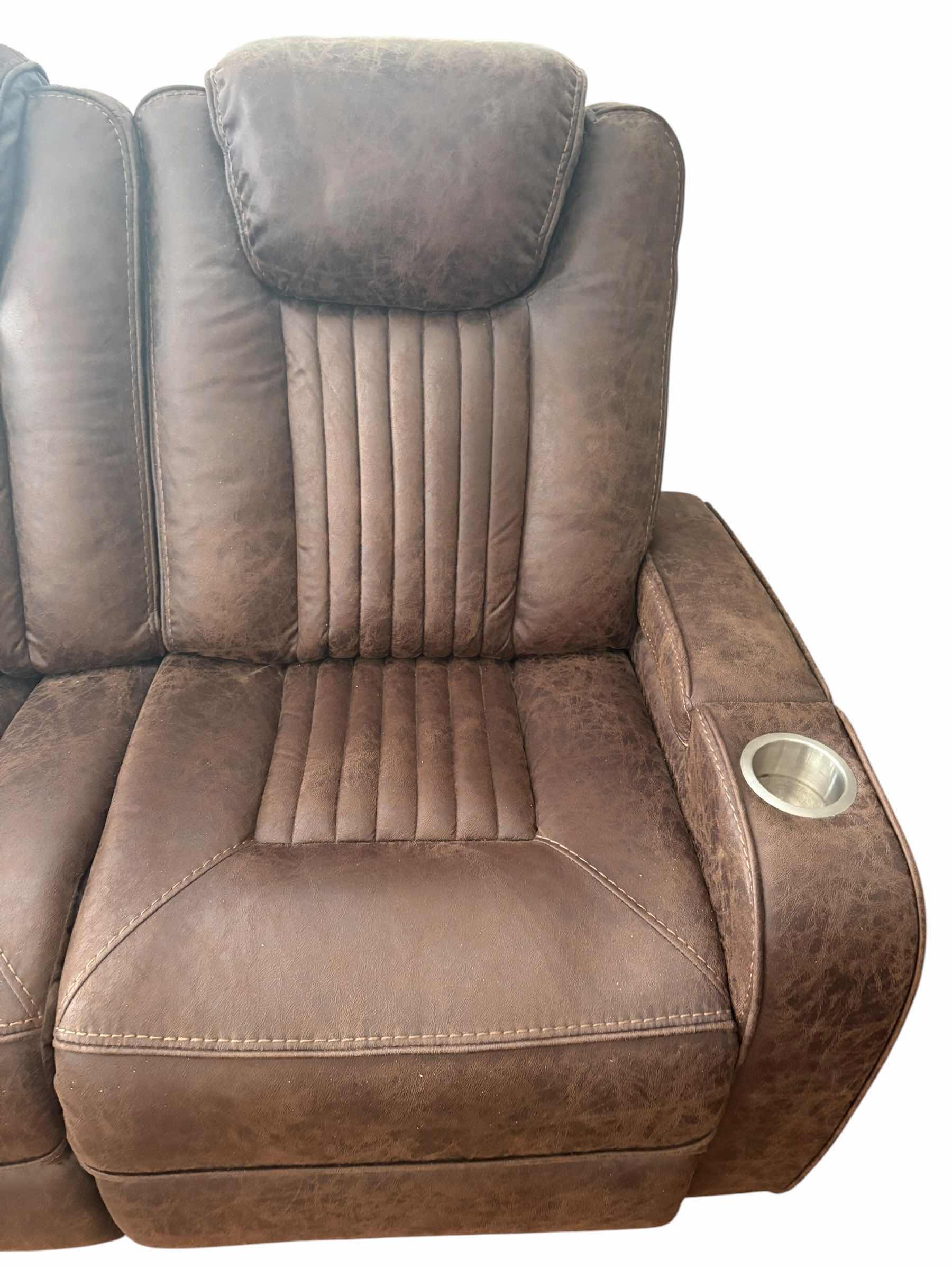 Photo 1 of BROWN LEATHER POWER SOFA RECLINER W ADJUSTABLE HEAD REST AND CUP HOLDERS 83”X34”H42.5” $3199