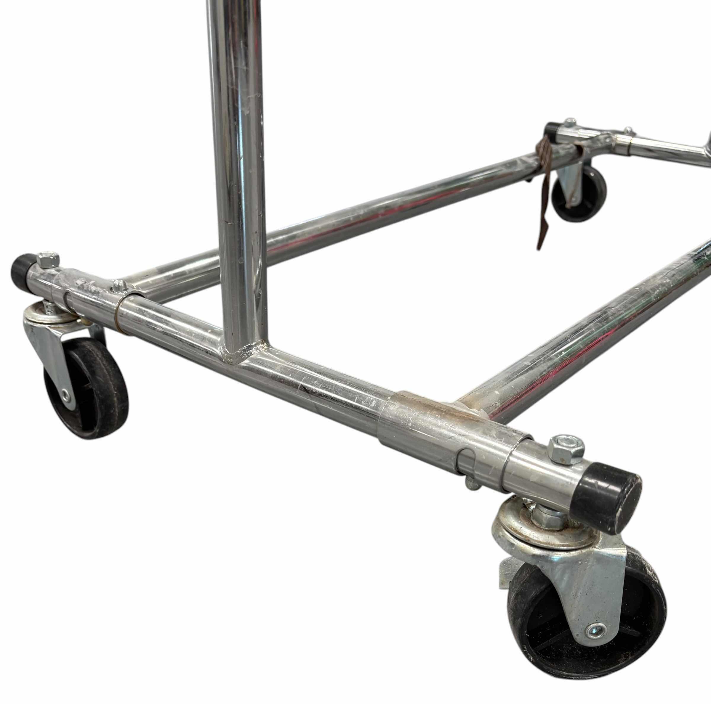 Photo 1 of ROLLING CLOTHING RACK 18” X 36” X 63”H