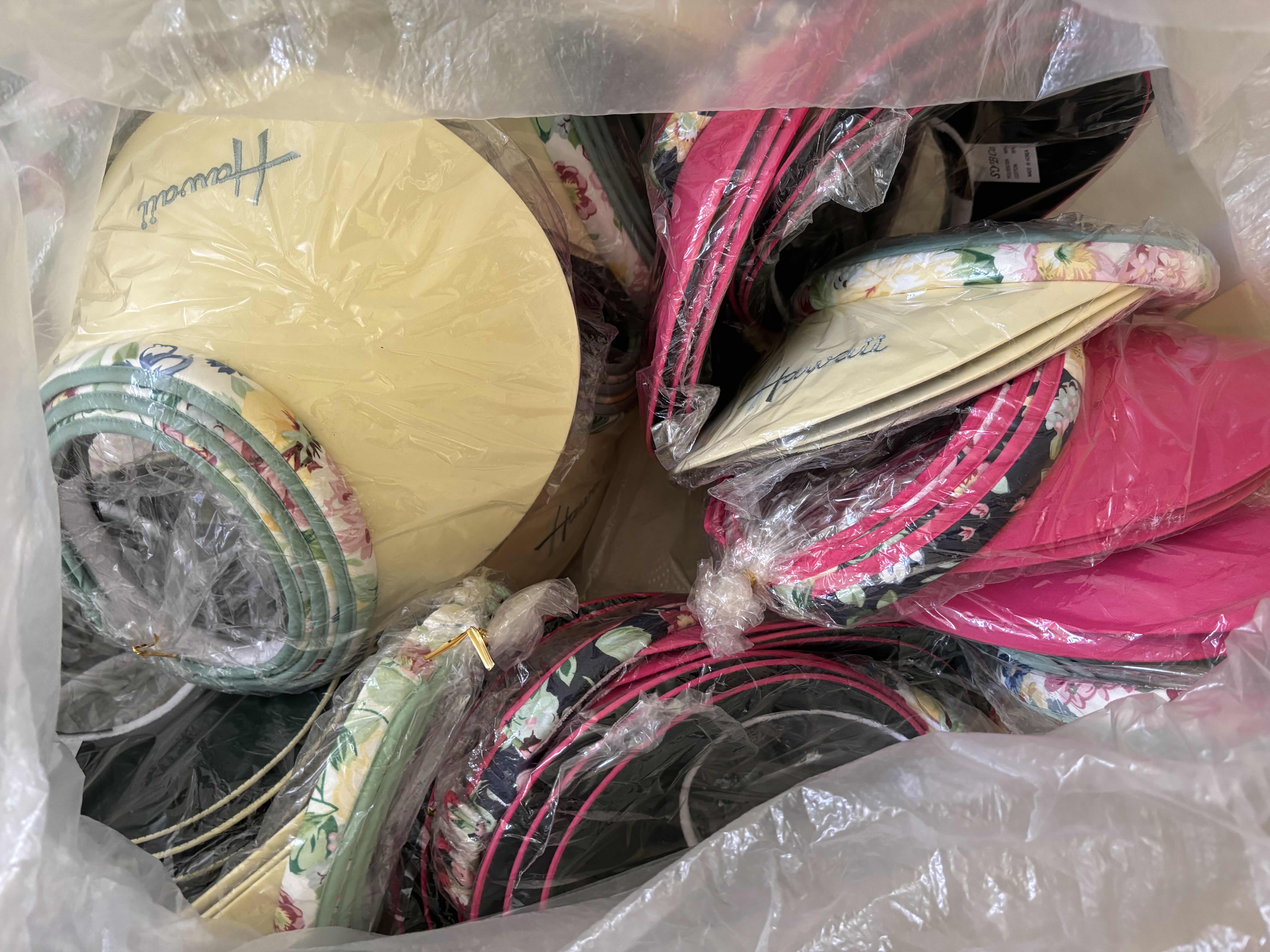 Photo 1 of LARGE BAG OF VISORS IN MULTIPLE COLORS & STYLES