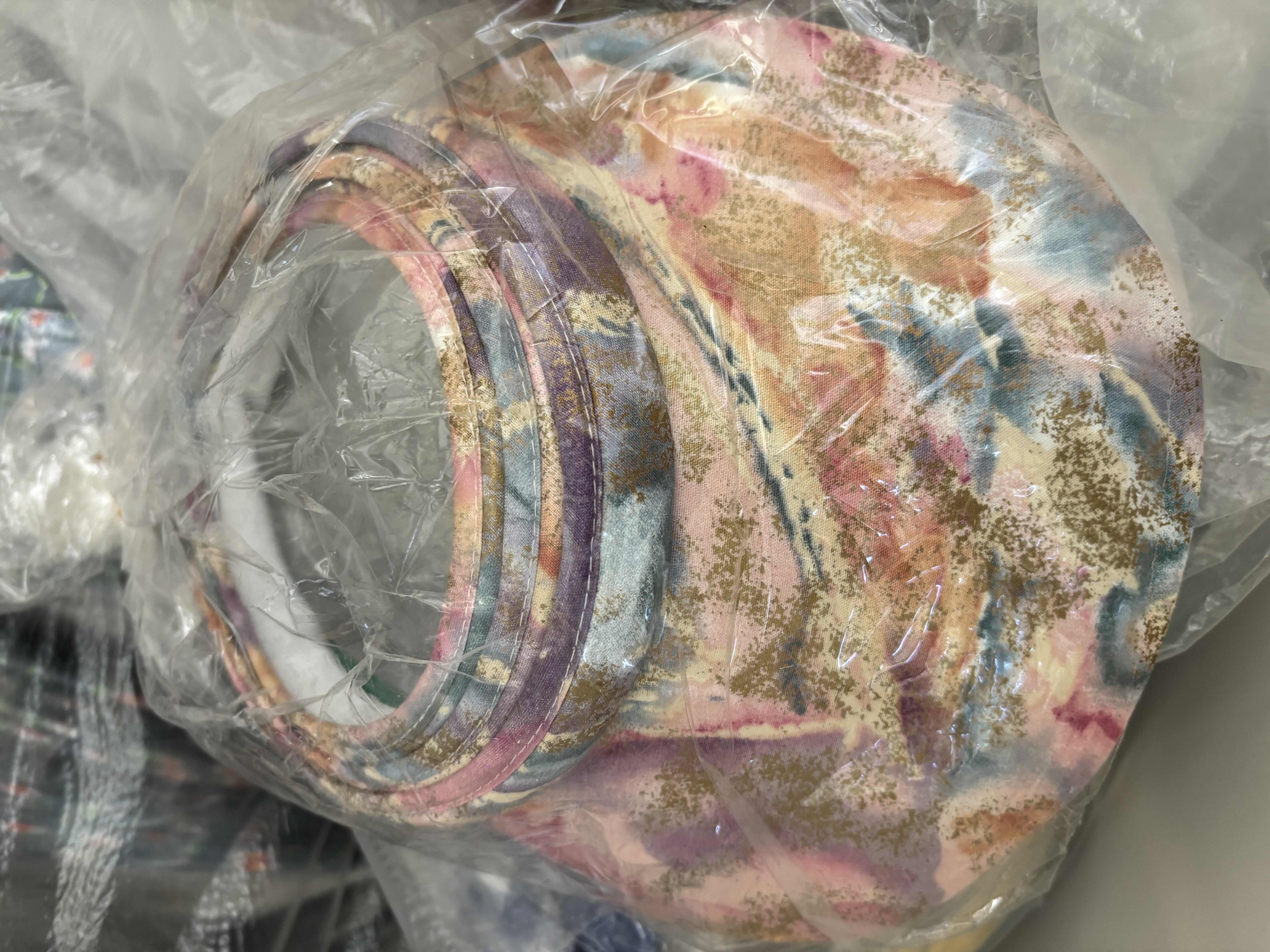 Photo 1 of LARGE BAGS OF VISORS IN MULTIPLE COLORS & STYLES