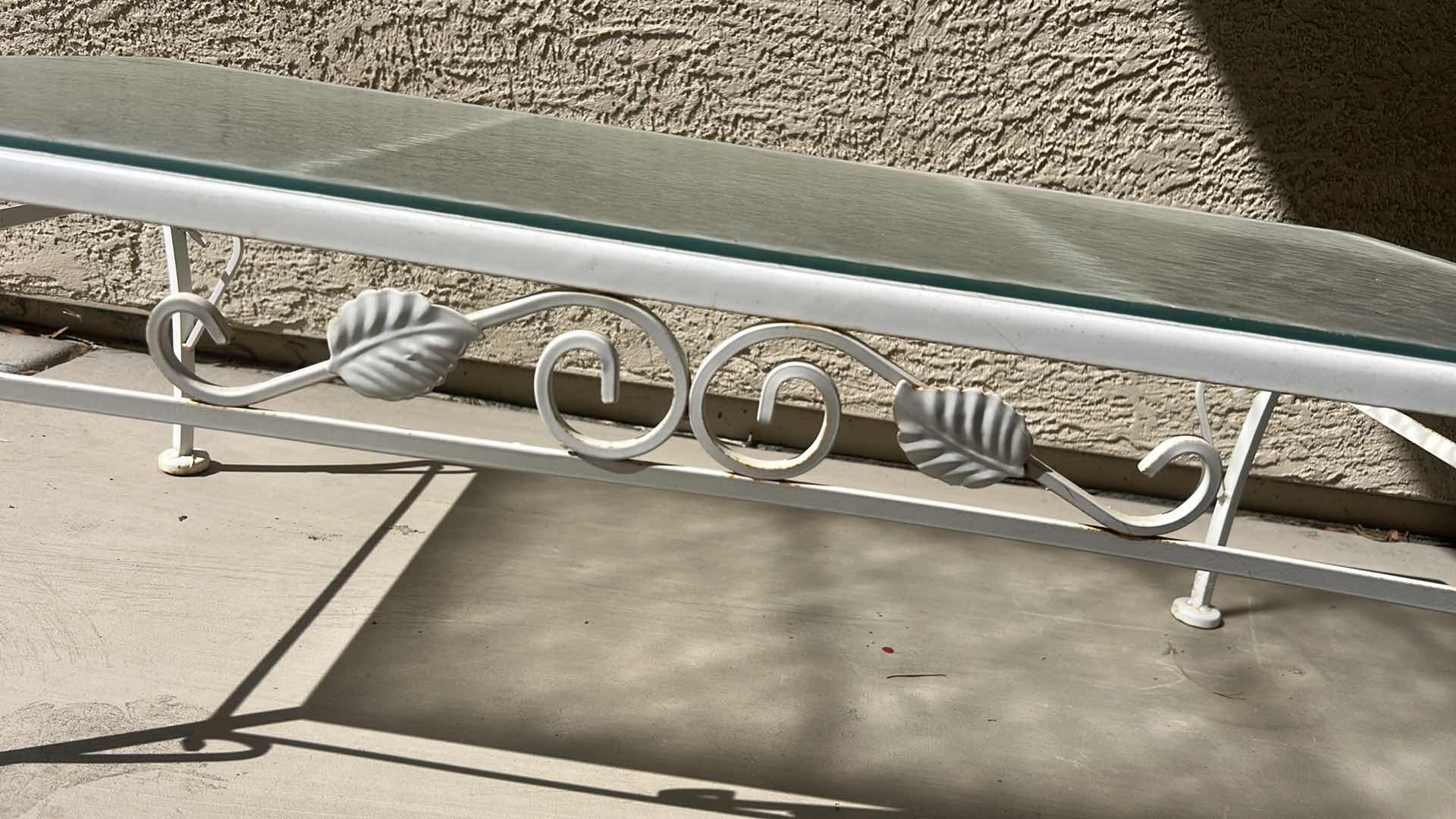 Photo 1 of WHITE WROUGHT IRON PATIO COFFEE TABLE W A GLASS TOP, OFTEN STYLED IN THE HOLLYWOOD REGENCY FASHION. 40“ X 20“ X H14 1/4“