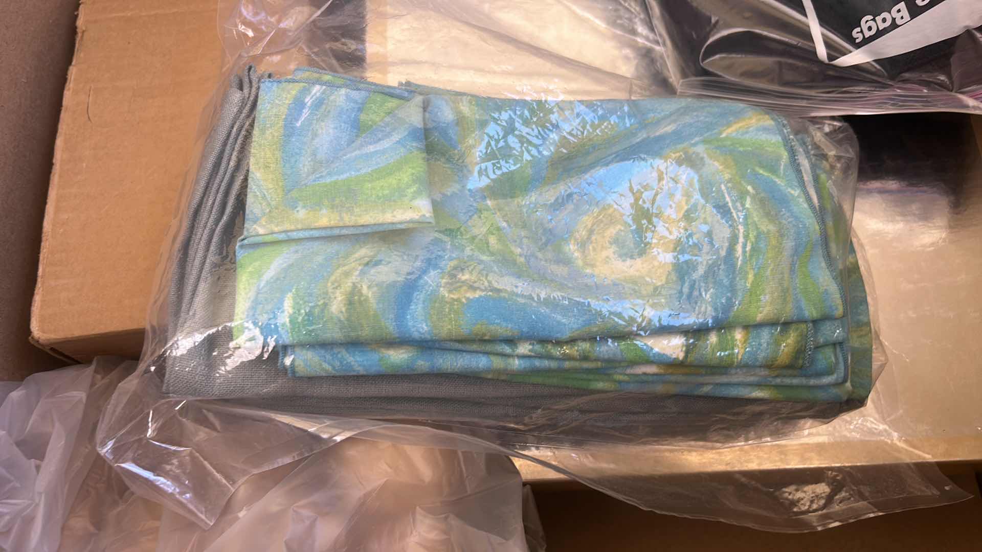 Photo 1 of BOX OF TABLECLOTHS AND CLOTH NAPKINS