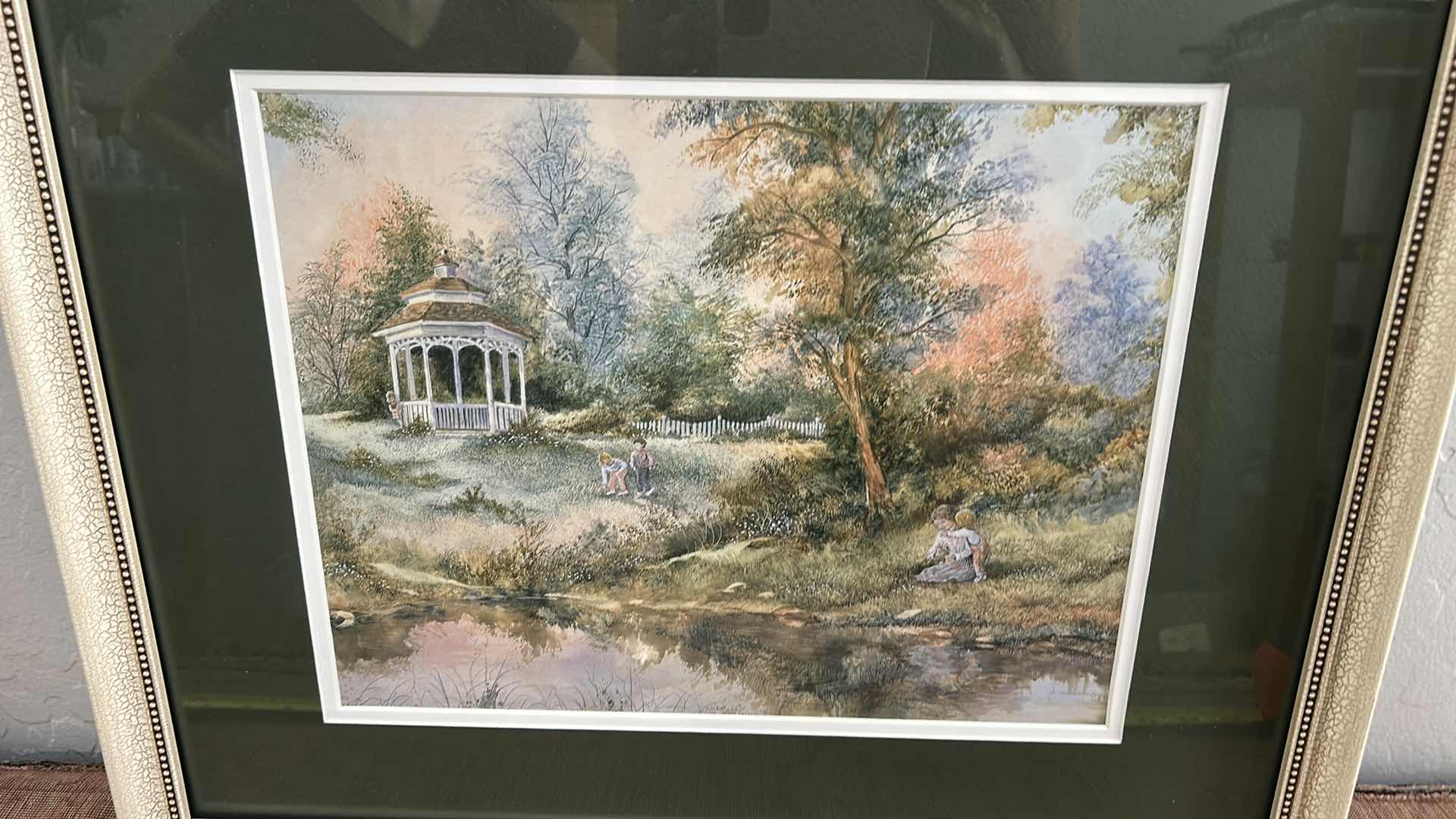 Photo 1 of FRAMED, ARTUR A. KAPLAN “PLAYING NEAR GAZEBO” LANDSCAPE ART PRINT  21 1/2” x H17 1/2”