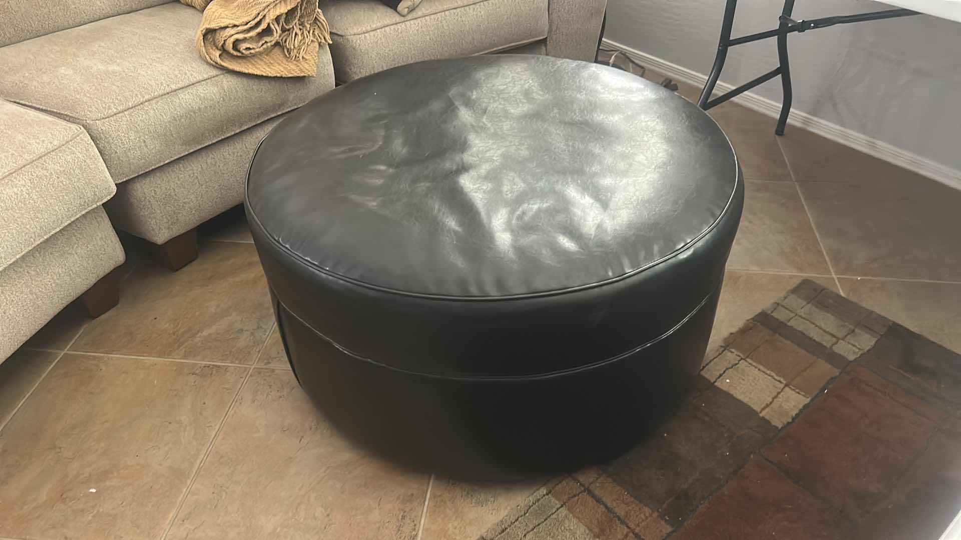 Photo 1 of ASHLEY FURNITURE ROUND IMITATION LEATHER OTTOMAN 38” x H19”