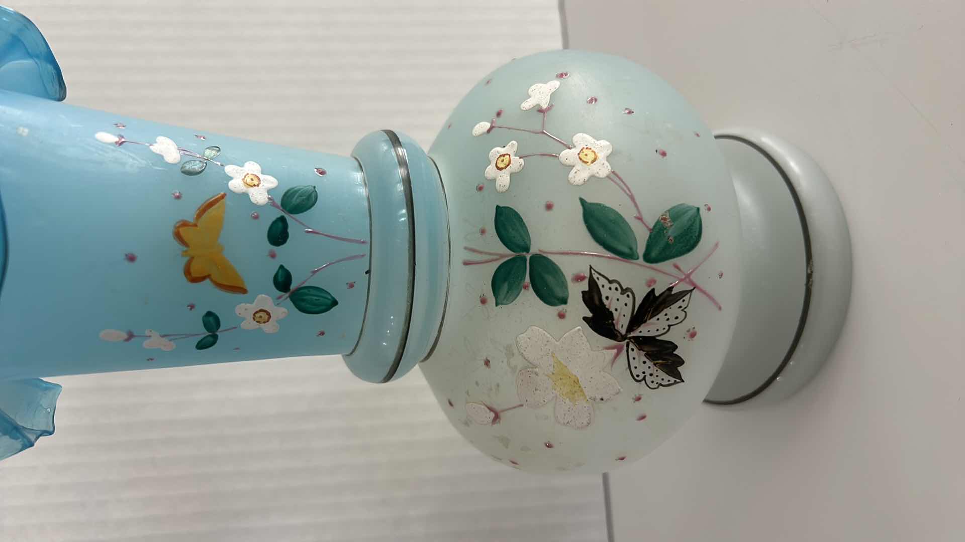 Photo 1 of VINTAGE BRISTOL GLASS VASE FEATURING A HAND-PAINTED BUTTERFLY & FLORAL ENAMEL DESIGN W A BLUE RUFFLED RIM H10.25”
