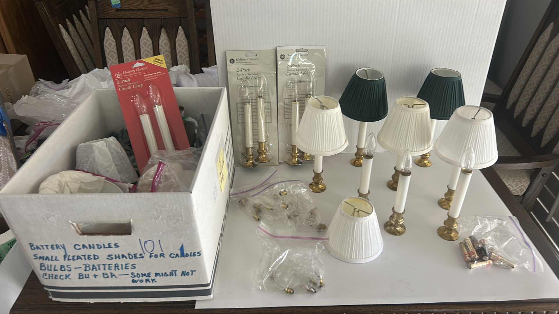 Photo 1 of BOX FULL OF BATTERY CANDLES, SMALL PLEATED SHADES FOR CANDLES, BULBS - BATTERIES