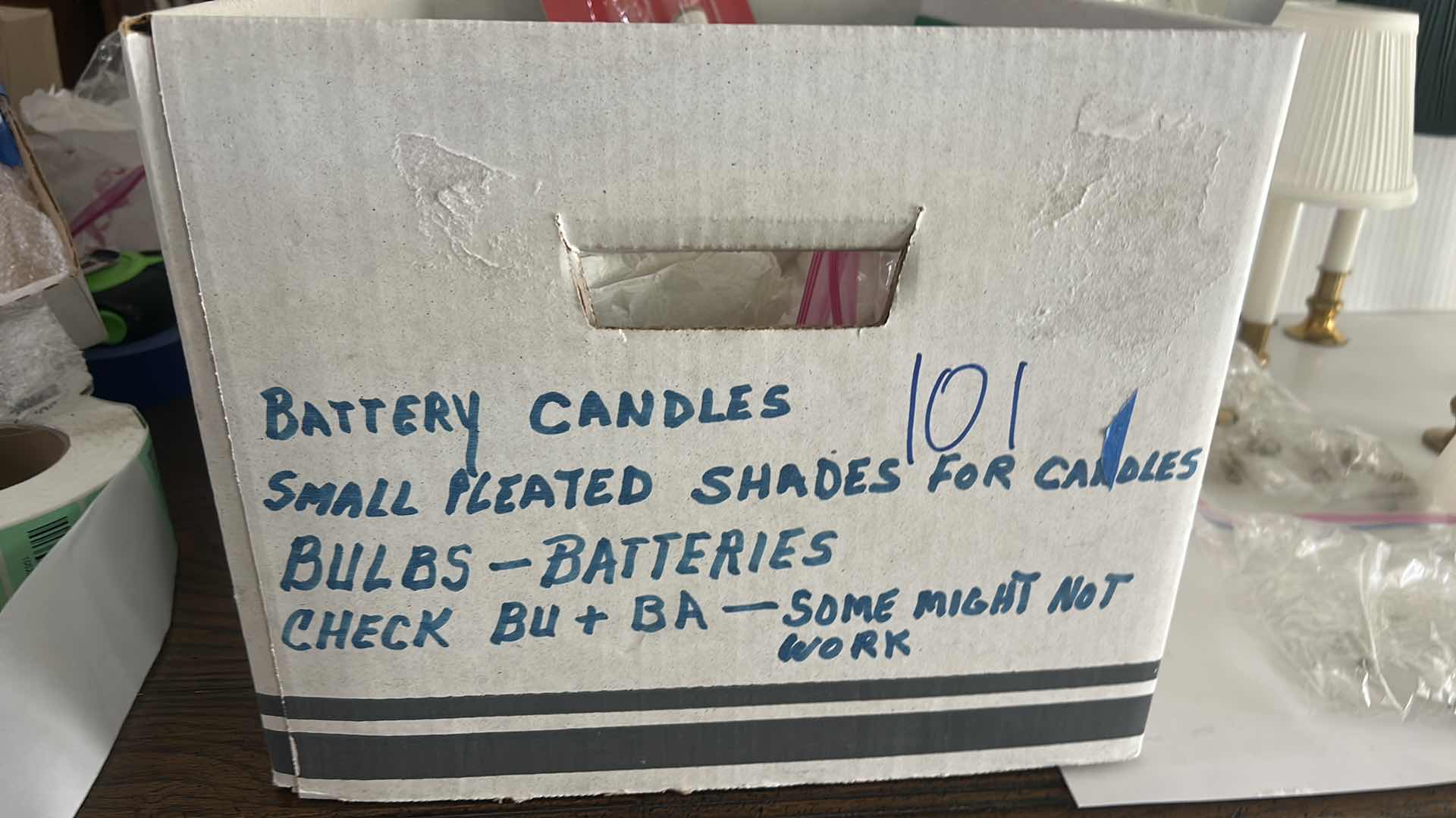 Photo 1 of BOX FULL OF BATTERY CANDLES, SMALL PLEATED SHADES FOR CANDLES, BULBS - BATTERIES