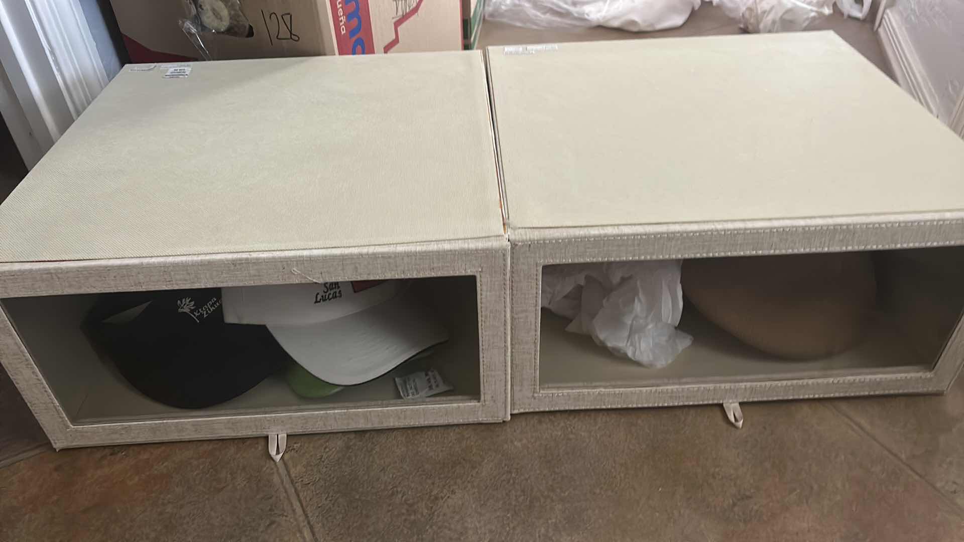 Photo 1 of TWO STORAGE BOXES WITH HATS $80