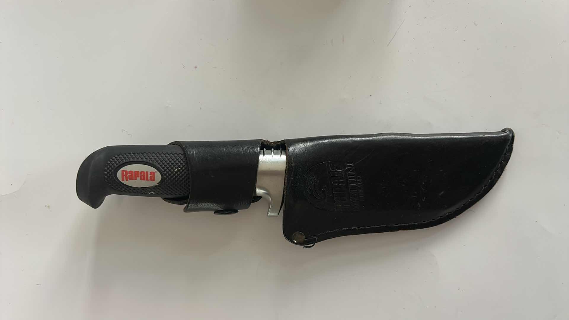 Photo 1 of RAPALA FIXED BLADE KNIFE.