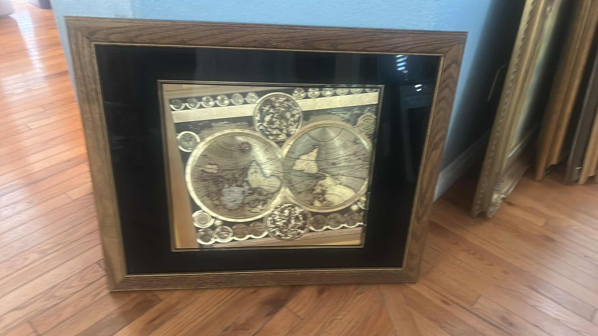Photo 1 of VINTAGE FRAMED PRINT ARTWORK OF THE PLANISPHAERIUM TERRESTRE WORLD MAP BY PETER SCHENK THE ELDER, FEATURING A DISTINCT GOLD FOIL FINISH. 25 1/2 x H32”