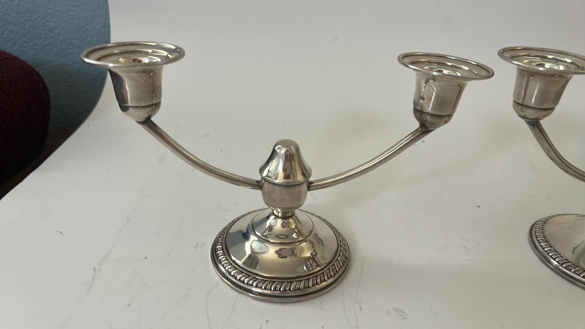 Photo 1 of PAIR OF STAMPED STERLING SILVER CANDELABRAS ( BOTTOMS REINFORCED WITH CEMENT FOR STABILITY)H5”