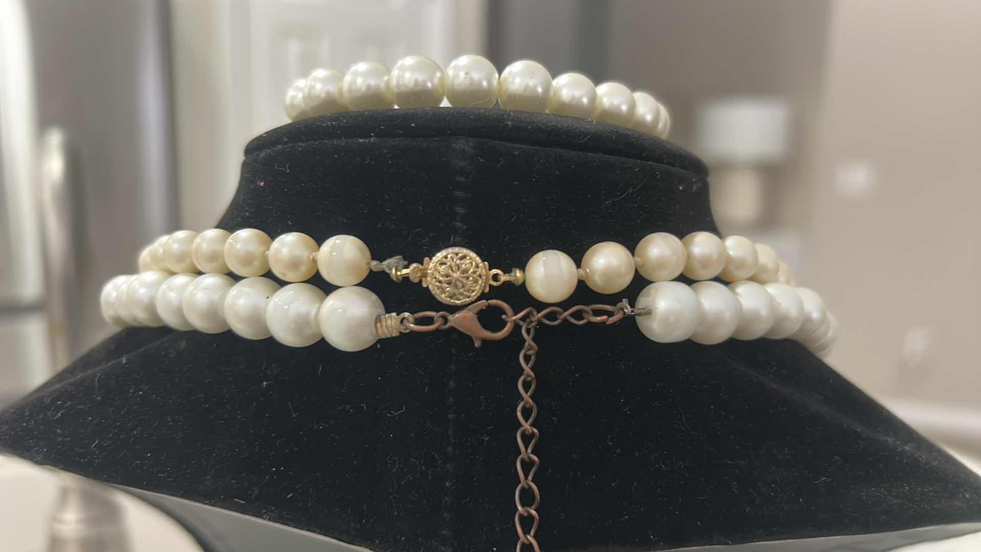 View 2 of VINTAGE FAUX PEARL SET WITH LAYERED NECKLACES, EARRINGS, AND BRACELET.