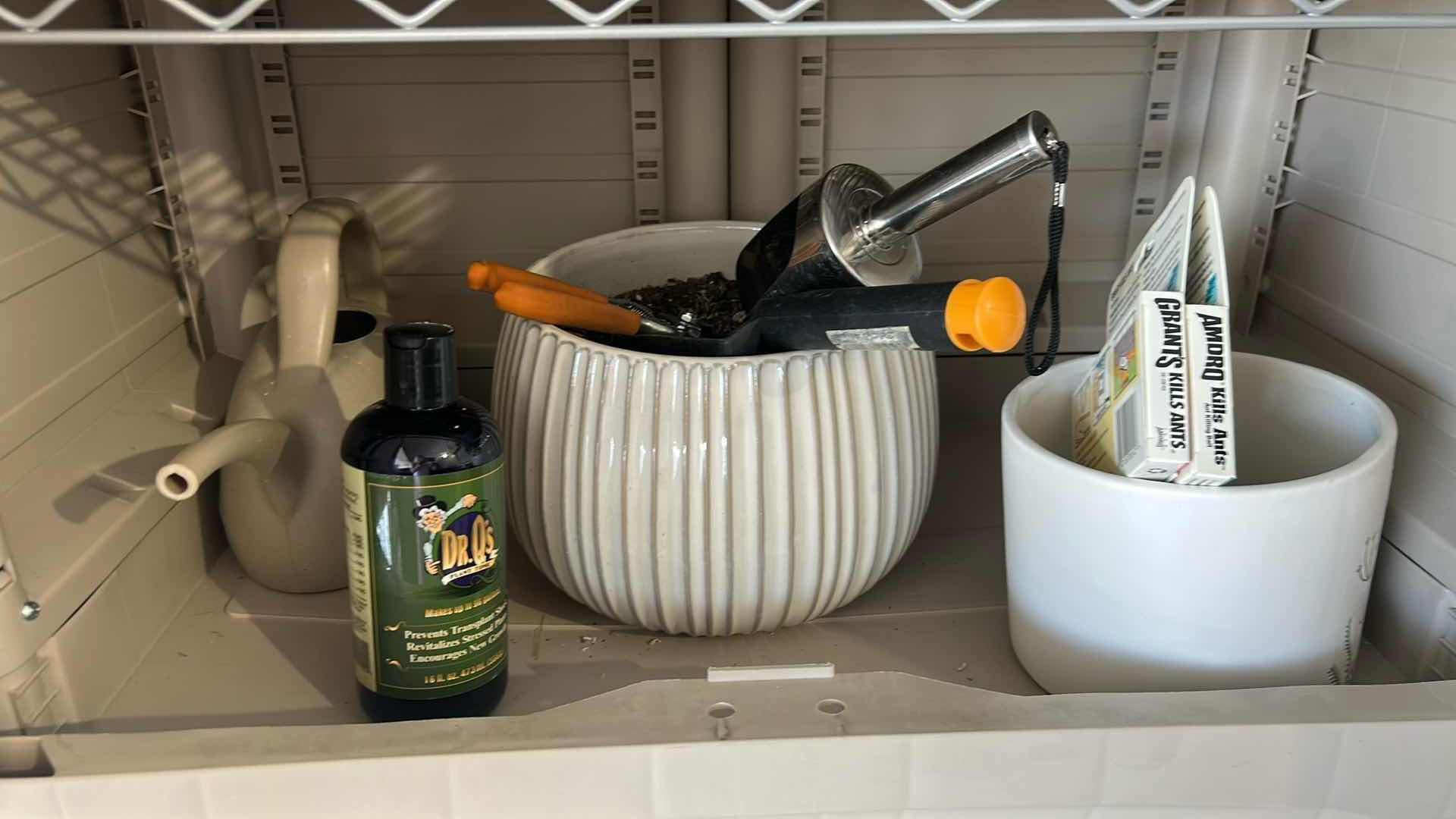 Photo 1 of CONTENTS OF GARAGE CABINET  GARDENING RAKE