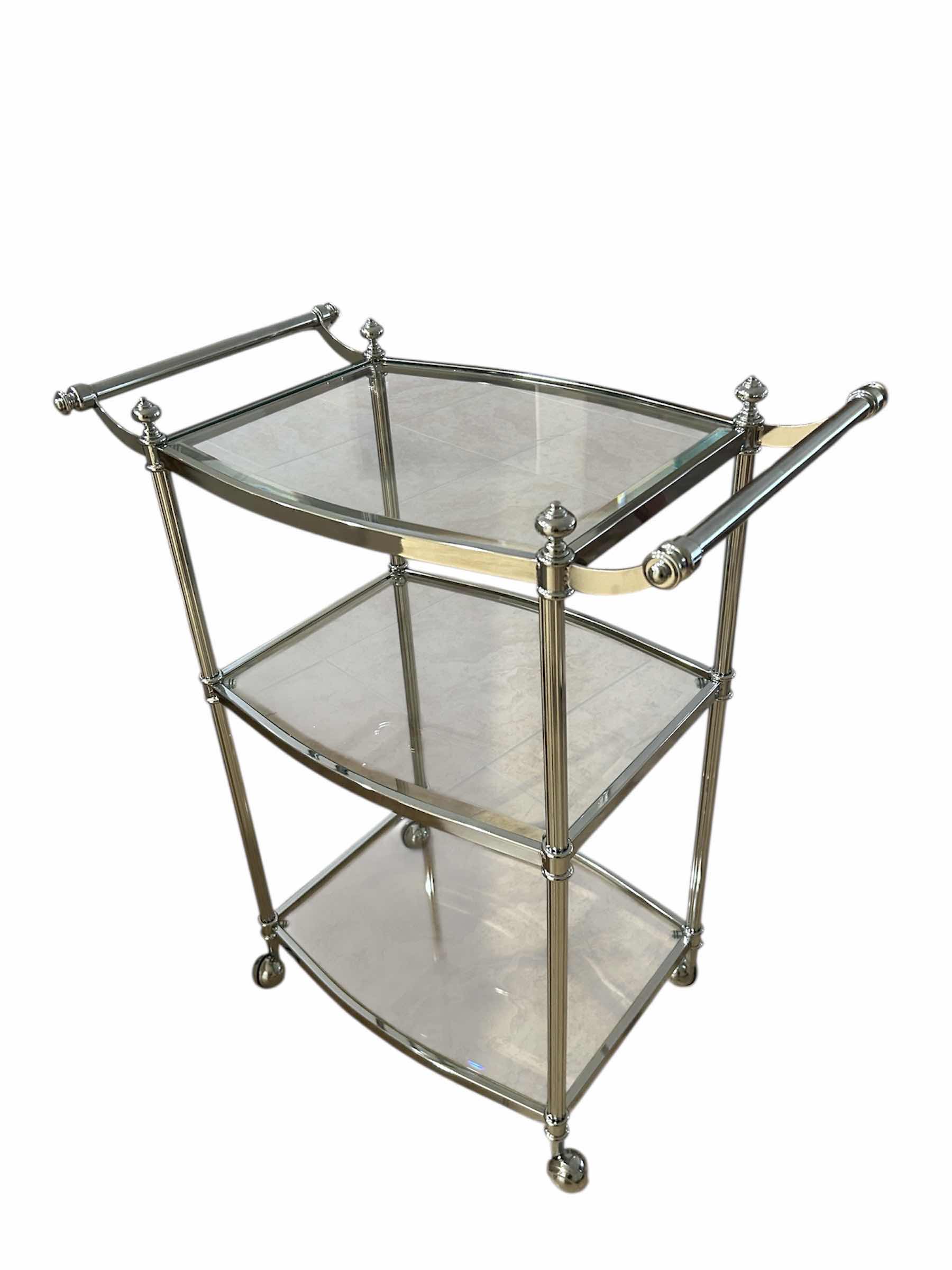 Photo 1 of THREE TIERED CHROME AND GLASS BAR CART ON COASTERS 26" X 16" H 31"