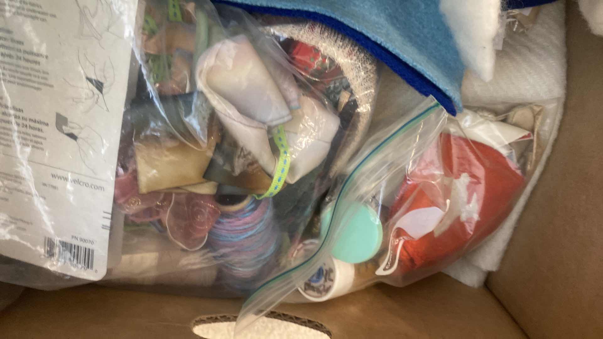 Photo 1 of FOUR BOXES OF FABRIC CHUNKY YARN AND CRAFTING SUPPLIES