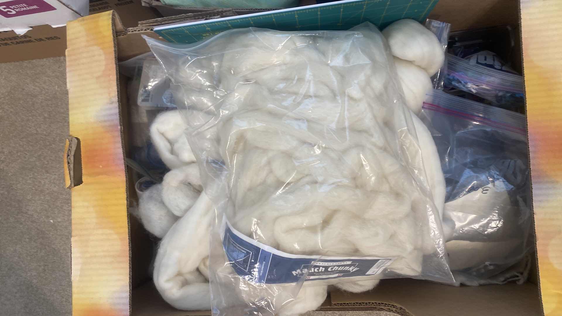 Photo 1 of FOUR BOXES OF FABRIC CHUNKY YARN AND CRAFTING SUPPLIES