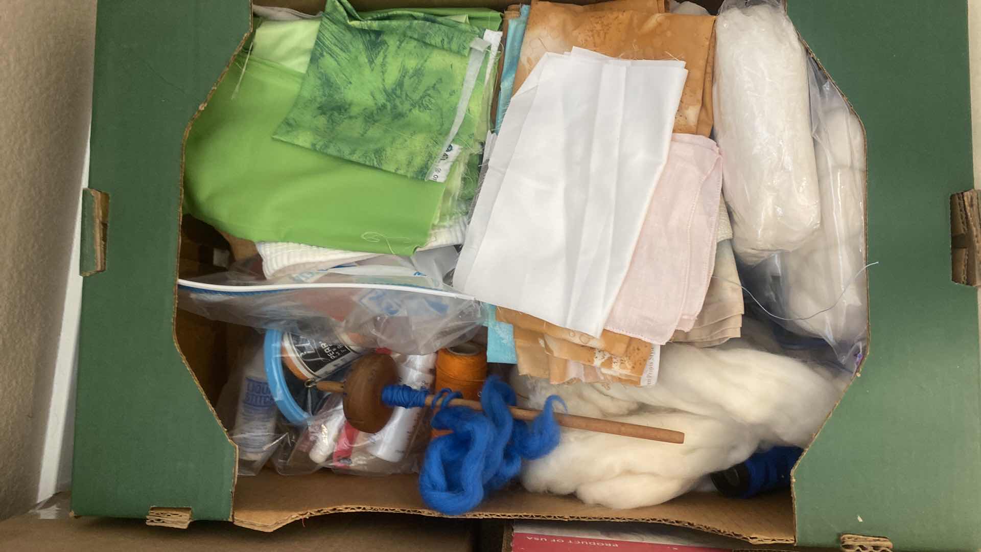 Photo 1 of FOUR BOXES OF FABRIC CHUNKY YARN AND CRAFTING SUPPLIES