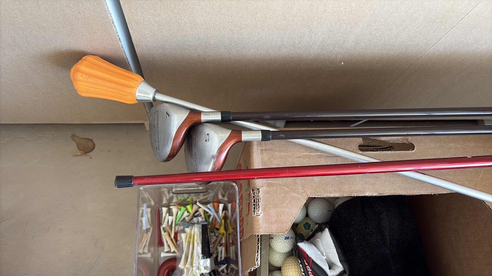 Photo 1 of BOX OF GOLF BALLS AND CLUBS L44” $230