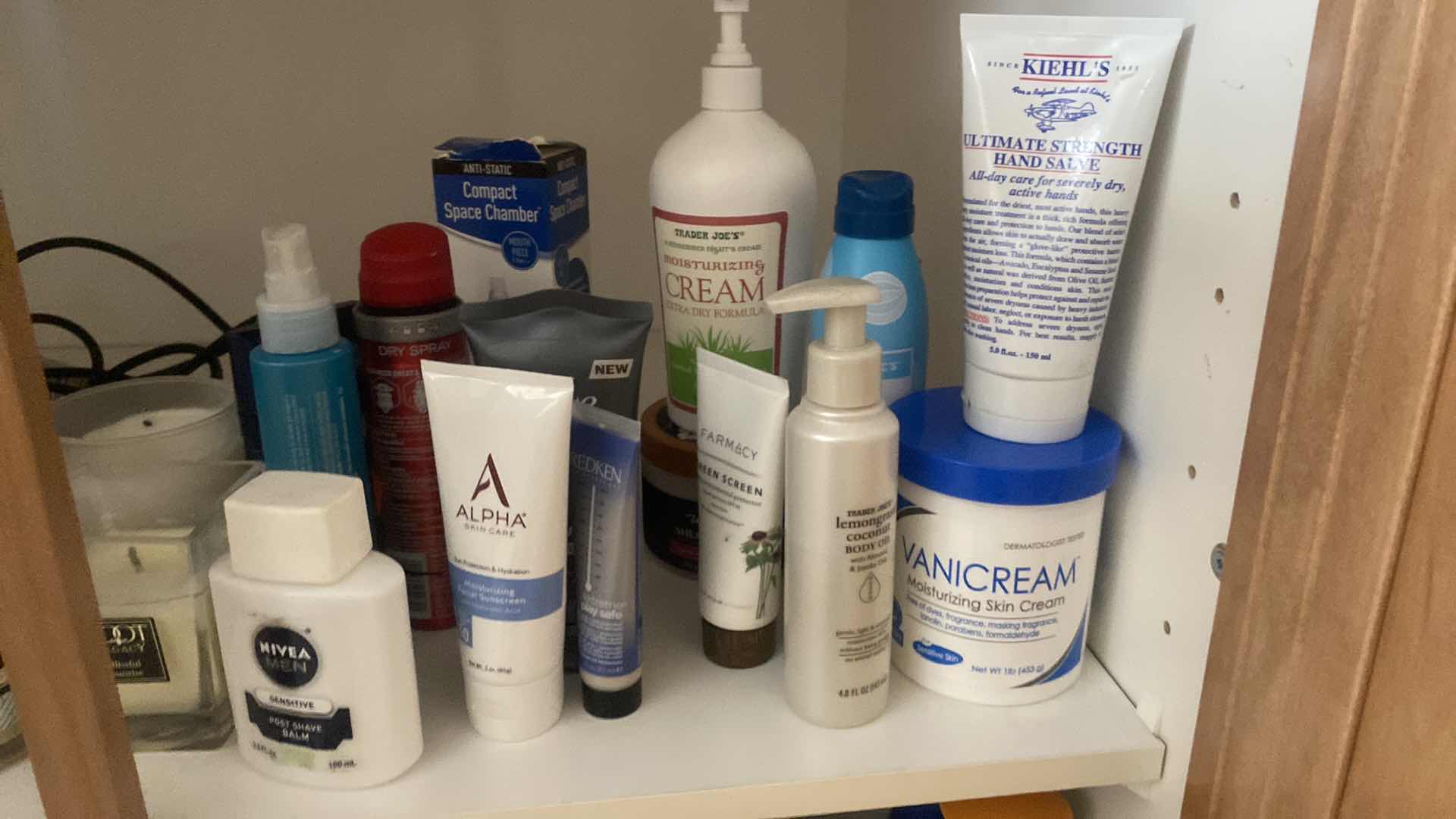 Photo 1 of CONTENTS OF CABINET PERSONAL CARE & CANDLES