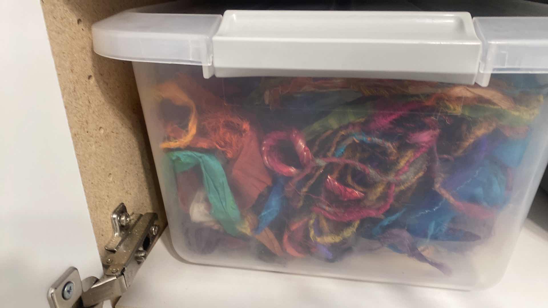 Photo 1 of CONTENTS OF CABINET THREE SHELVES OF CRAFTING SUPPLIES FABRIC AND YARN