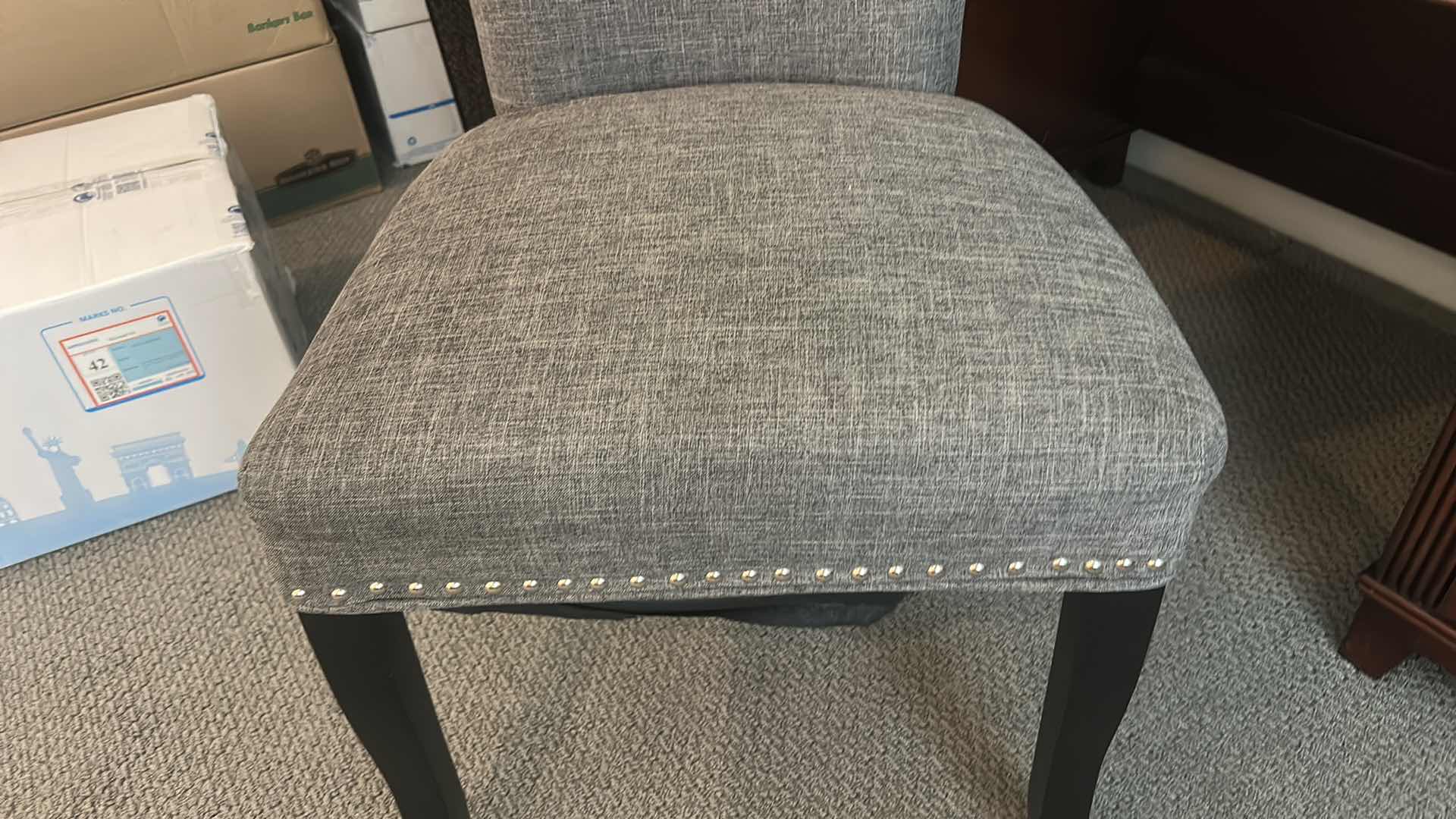 Photo 1 of GRAY UPHOLSTERED DINING CHAIR / DESK CHAIR WITH NAILHEAD TRIM AND BLACK LEGS 21 1/2” x 21” x H27 1/2”