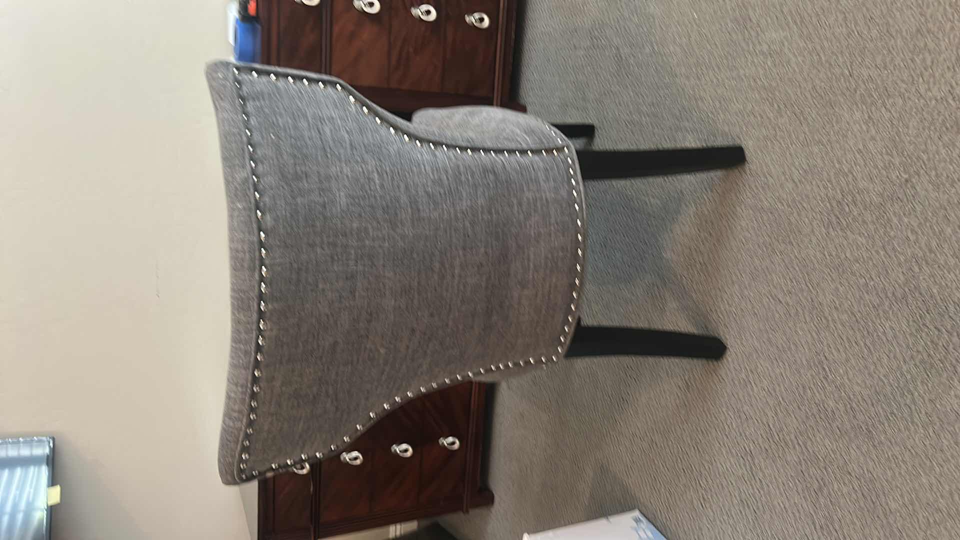 Photo 1 of GRAY UPHOLSTERED DINING CHAIR / DESK CHAIR WITH NAILHEAD TRIM AND BLACK LEGS 21 1/2” x 21” x H27 1/2”