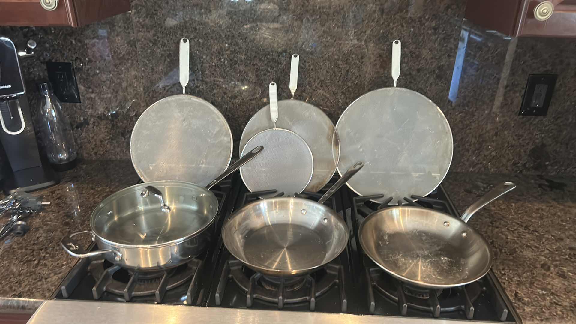 Photo 1 of 3 EMERIL SKILLETS AND 4 OIL SPATTER COVERS