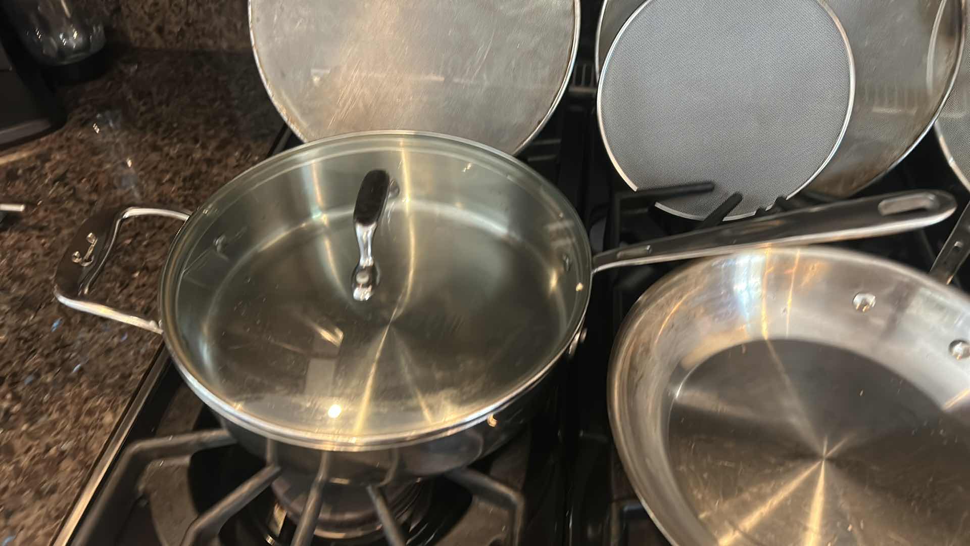 Photo 1 of 3 EMERIL SKILLETS AND 4 OIL SPATTER COVERS
