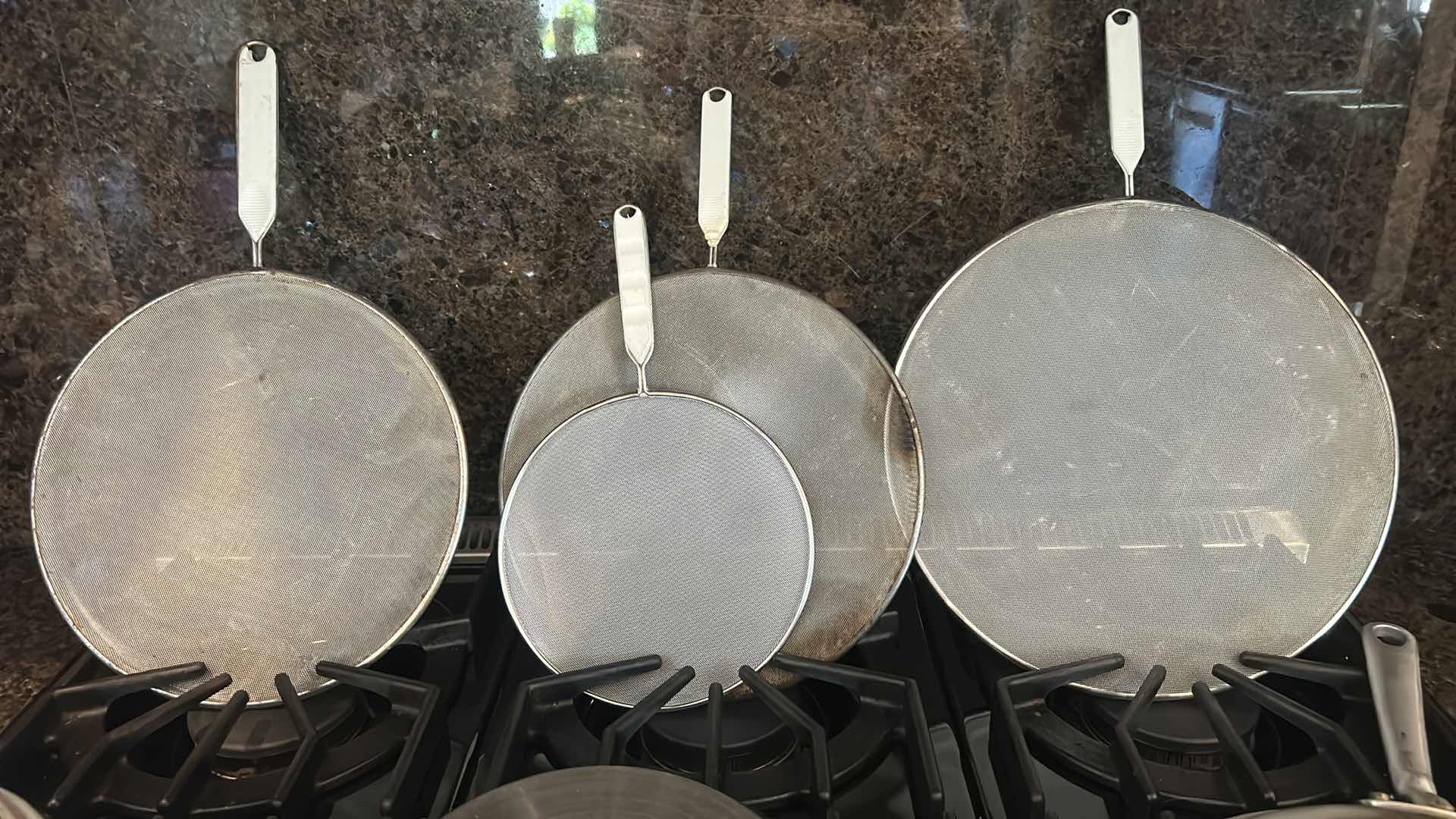 Photo 1 of 3 EMERIL SKILLETS AND 4 OIL SPATTER COVERS
