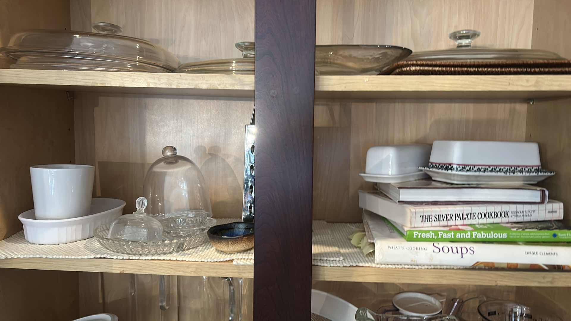 Photo 1 of CONTENTS IN KITCHEN CABINET- PITCHERS, COOKBOOKS, MEASURING CUPS AND MORE