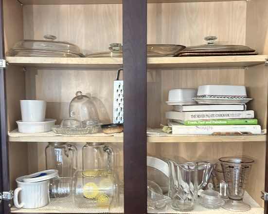 Photo 1 of CONTENTS IN KITCHEN CABINET- PITCHERS, COOKBOOKS, MEASURING CUPS AND MORE