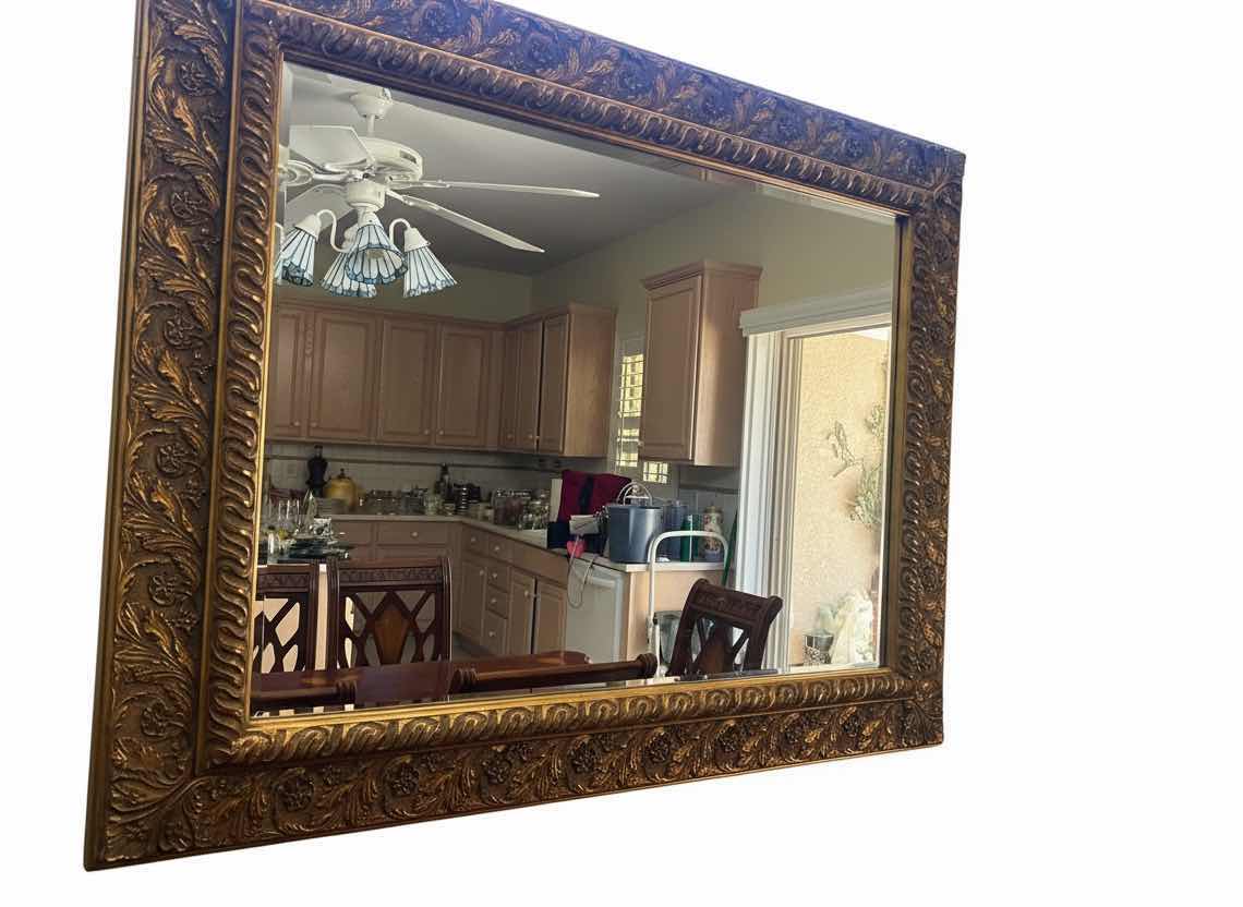 Photo 1 of VINTAGE-STYLE RECTANGULAR BEVELED MIRROR FEATURING A LARGE WOOD GOLD GILT FRAME WITH ORNATE FLORAL AND VINE CARVINGS. 49 1/2“ x 41“.