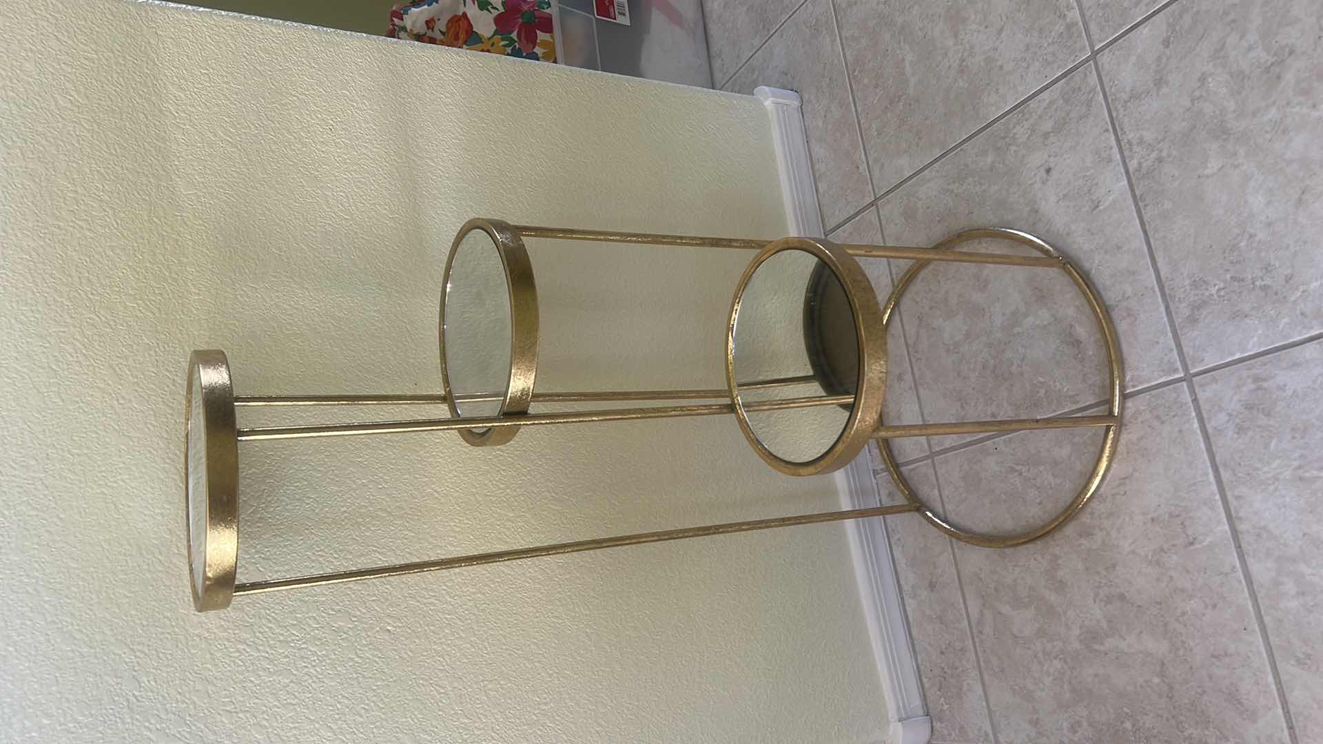 Photo 1 of GOLD METAL PLANT STAND FEATURING THREE ROUND MIRRORED DISPLAY SHELVES AT STAGGERED HEIGHTS 14” x H32”.  $40