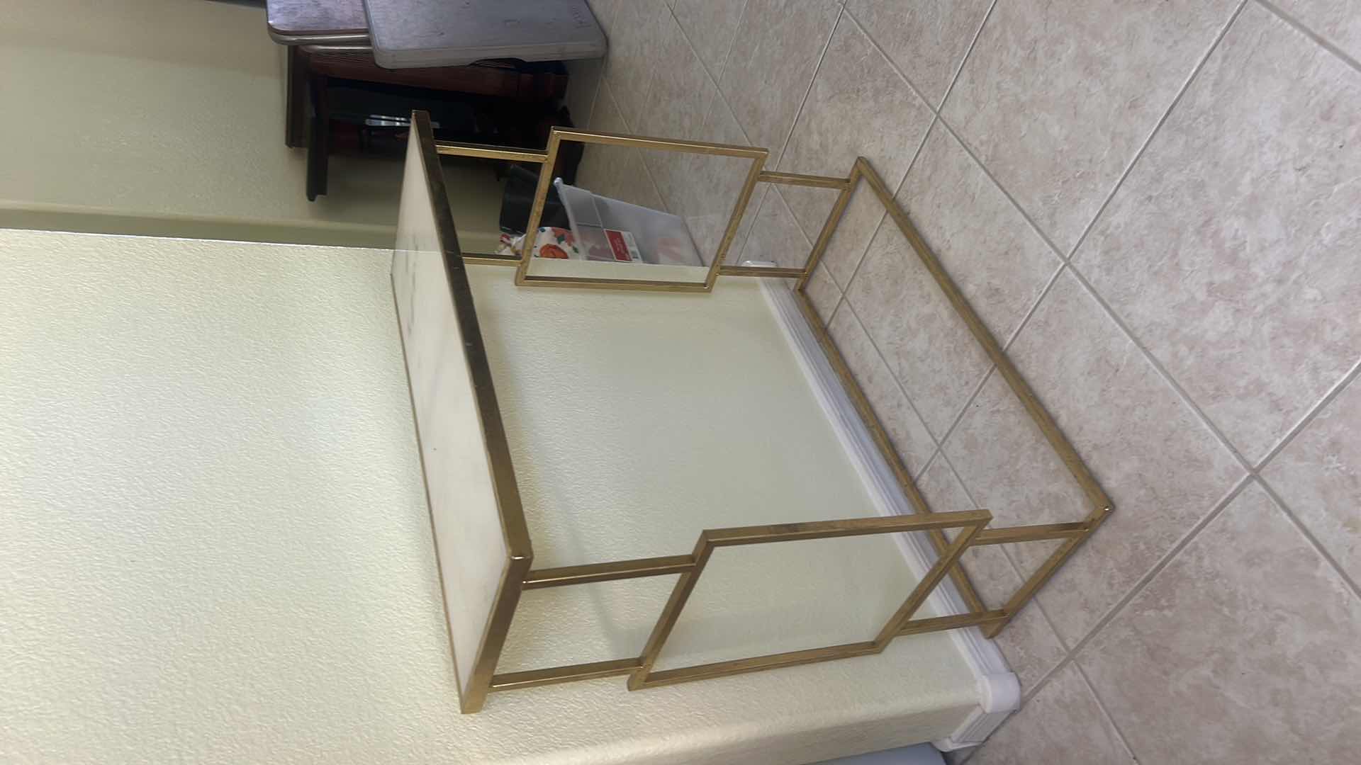 Photo 1 of GOLD METAL CONSOLE TABLE FEATURING A WHITE MARBLE TOP AND AN OPEN GEOMETRIC FRAME  27 1/2“ x 11“ x 28“
