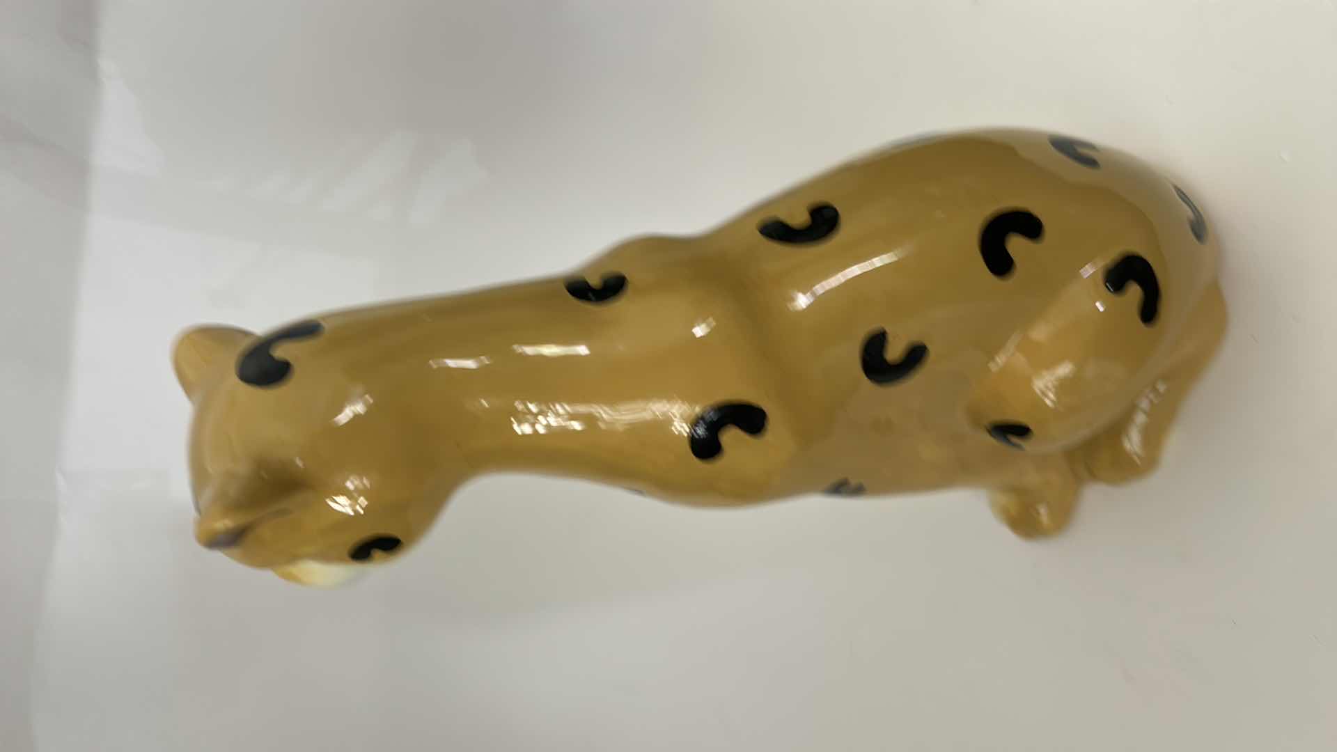 Photo 1 of CERAMIC CHEETAH FIGURINE FEATURES HAND-PAINTED DETAILS AND A GLOSSY FINISH. H13”