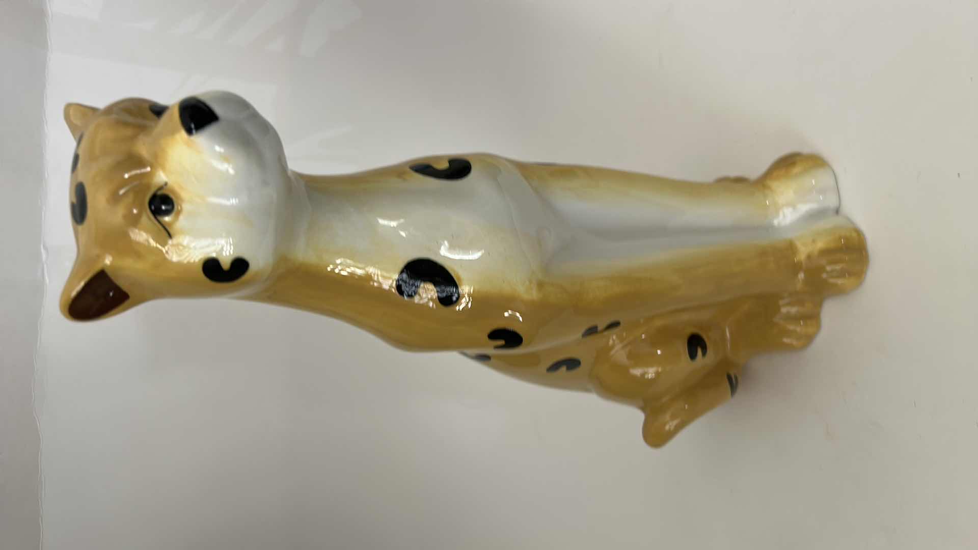 Photo 1 of CERAMIC CHEETAH FIGURINE FEATURES HAND-PAINTED DETAILS AND A GLOSSY FINISH. H13”
