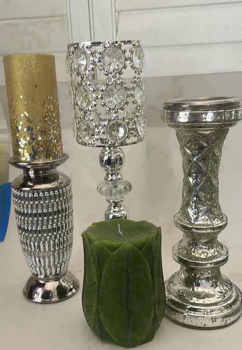 Photo 1 of THREE SILVER TONE CANDLE HOLDERS AND TWO DECORATIVE CANDLES. (TALLEST 16”)