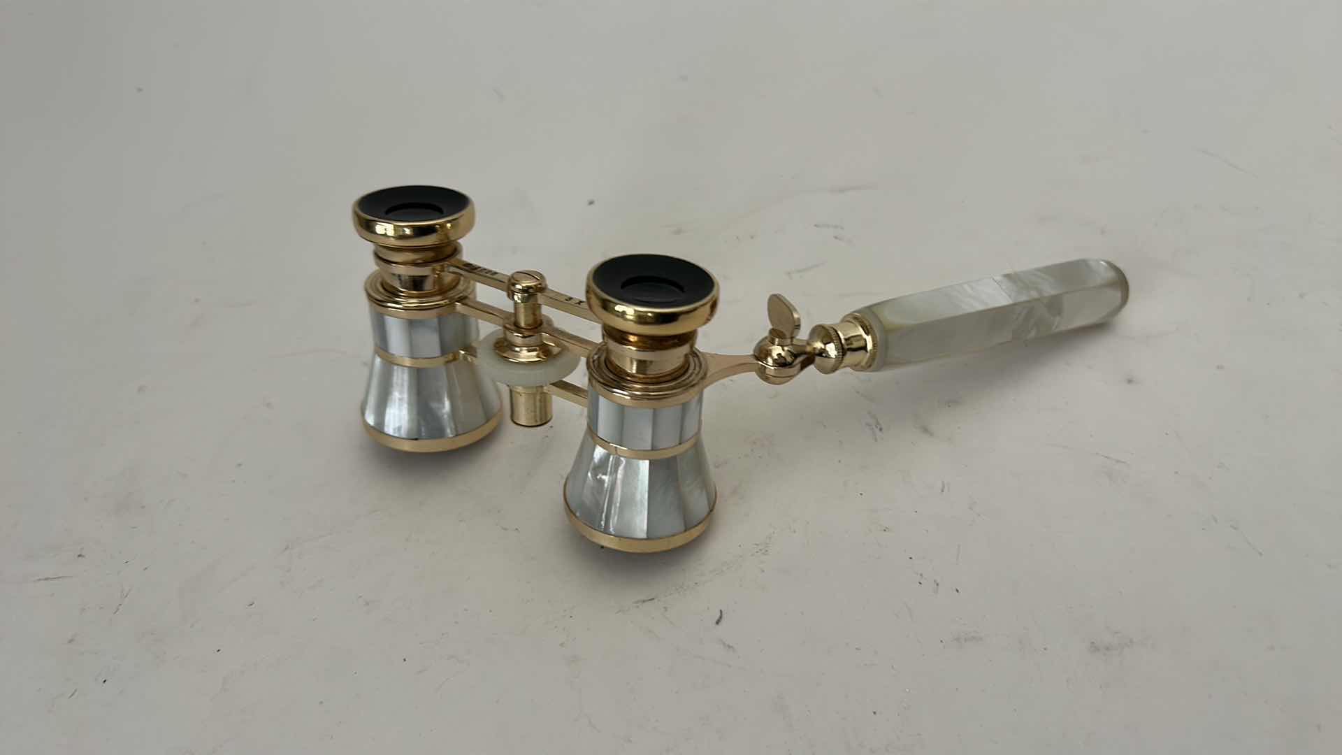 Photo 1 of MIGNON VINTAGE-STYLE OPERA GLASSES FEATURE A GOLD-PLATED BRASS FRAME W INTRICATE MOTHER-OF-PEARL INLAY &  MATCHING EXTENDABLE HANDLE.