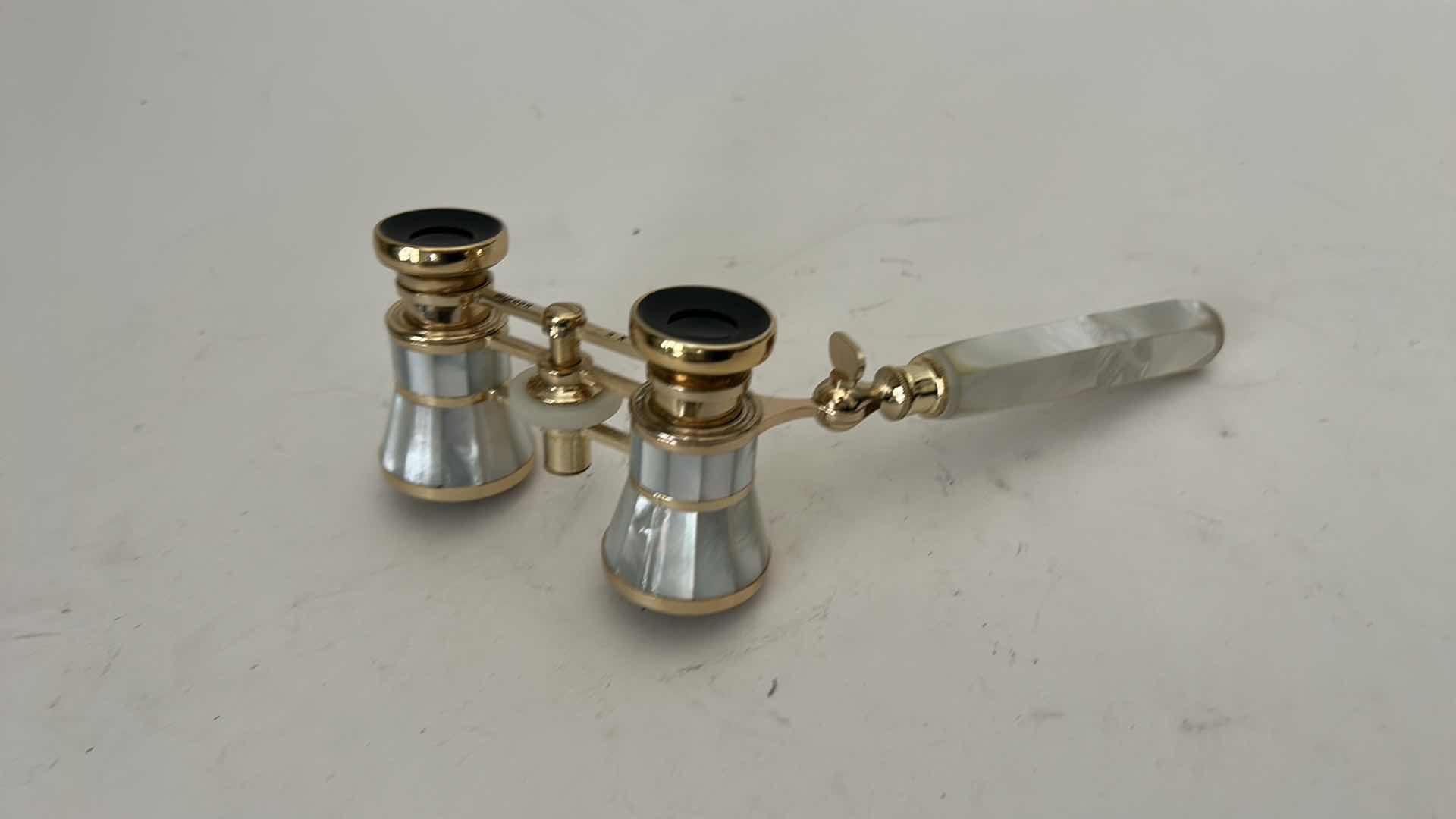 Photo 1 of MIGNON VINTAGE-STYLE OPERA GLASSES FEATURE A GOLD-PLATED BRASS FRAME W INTRICATE MOTHER-OF-PEARL INLAY &  MATCHING EXTENDABLE HANDLE.