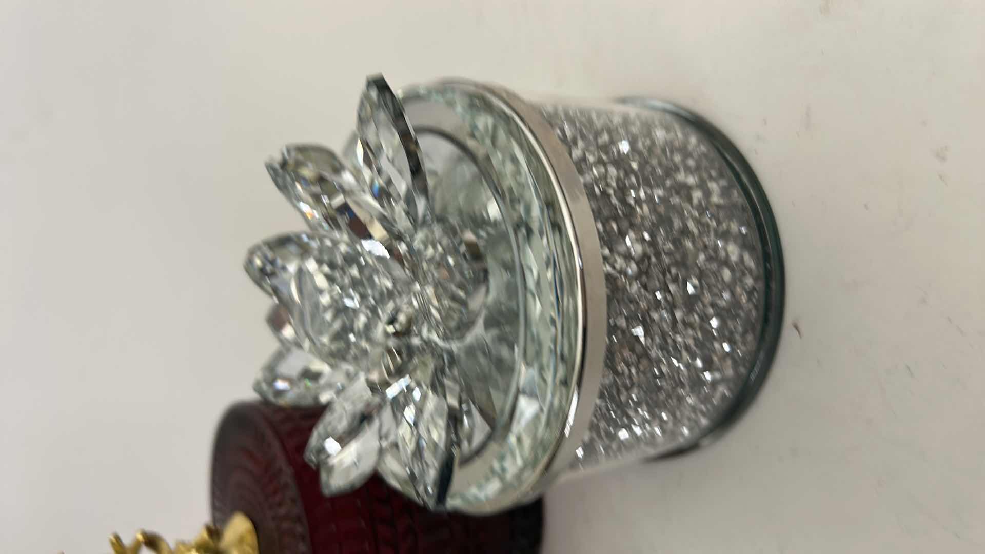Photo 1 of SAGEBROOK HOME DECORATIVE BOXES FEATURE CRYSTAL LOTUS FLOWER LIDS AND GLITTER-FILLED OR FACETED GLASS BODIES FOR STORING SMALL TREASURES & RUBY-COLORED LVD GLASS TRINKET BOX FEATURES A DISTINCTIVE GOLD REINDEER TOPPER. $125