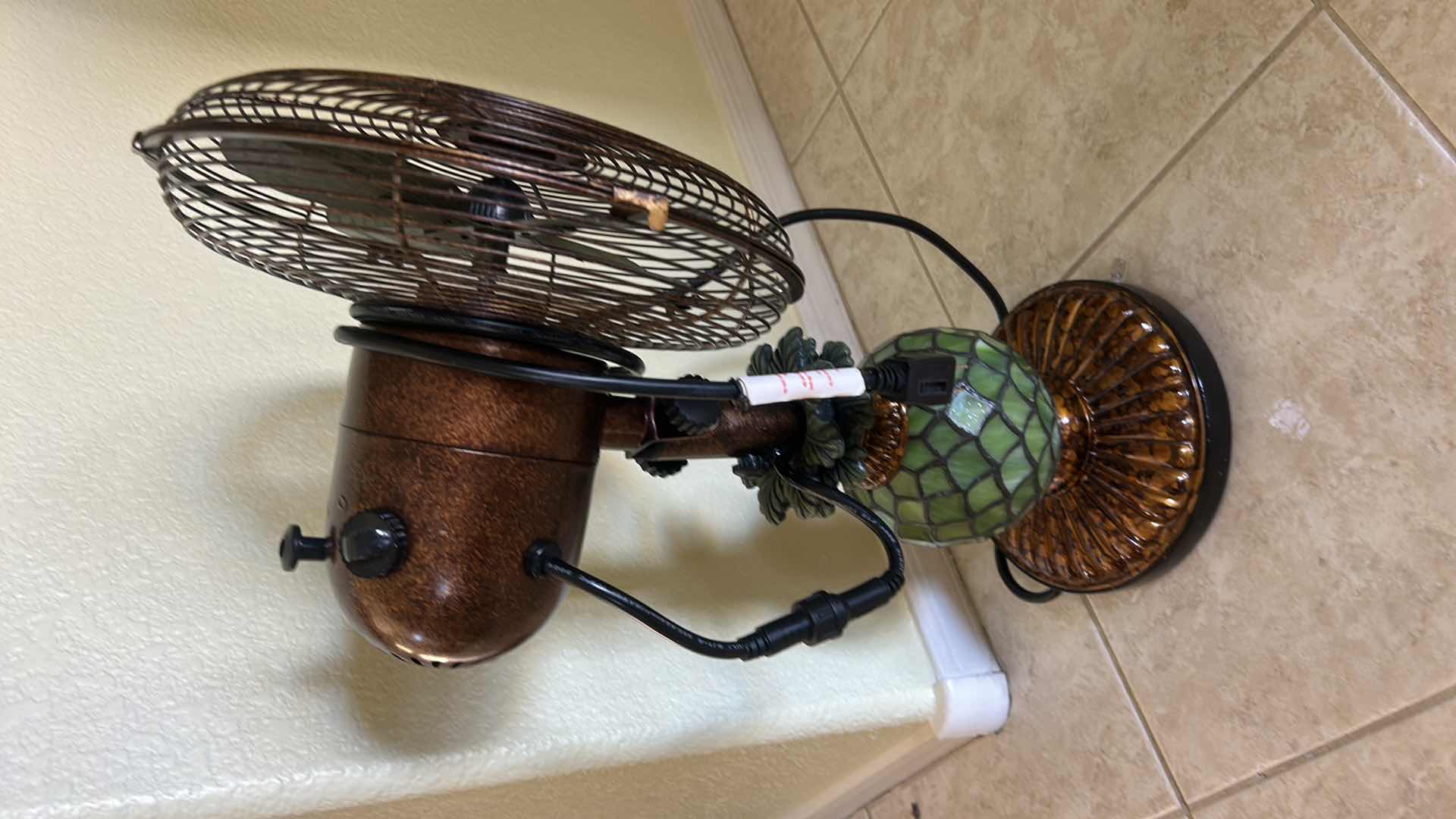 Photo 1 of DECOBREEZE PINEAPPLE FAN FEATURES A TIFFANY-STYLE GREEN MOSAIC GLASS BASE THAT DOUBLES AS A LAMP. H22” $200
