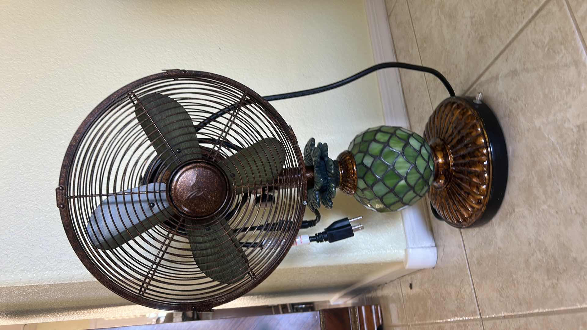 Photo 1 of DECOBREEZE PINEAPPLE FAN FEATURES A TIFFANY-STYLE GREEN MOSAIC GLASS BASE THAT DOUBLES AS A LAMP. H22” $200