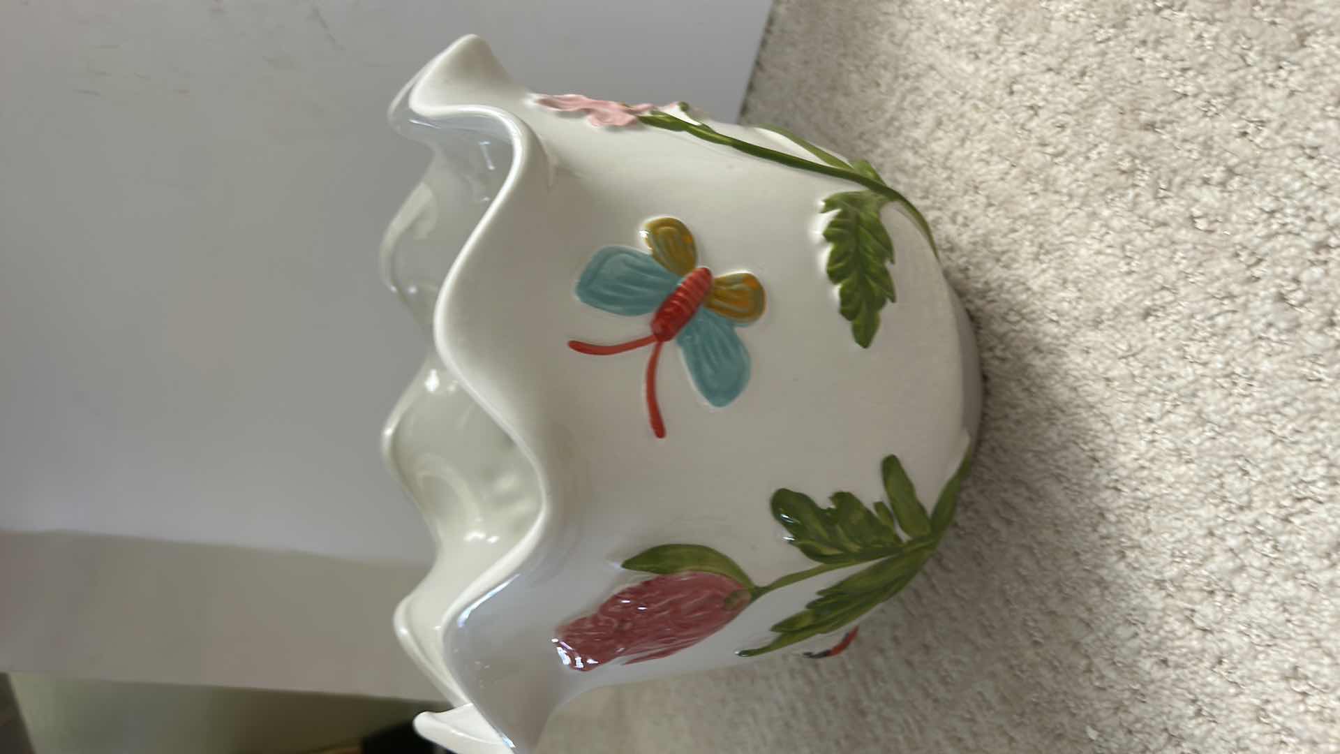 Photo 1 of WHITE CERAMIC PLANTER ARTWARE FEATURING A COLORFUL, HAND-PAINTED BUTTERFLY AND FLORAL DESIGN. 
10” x H9”